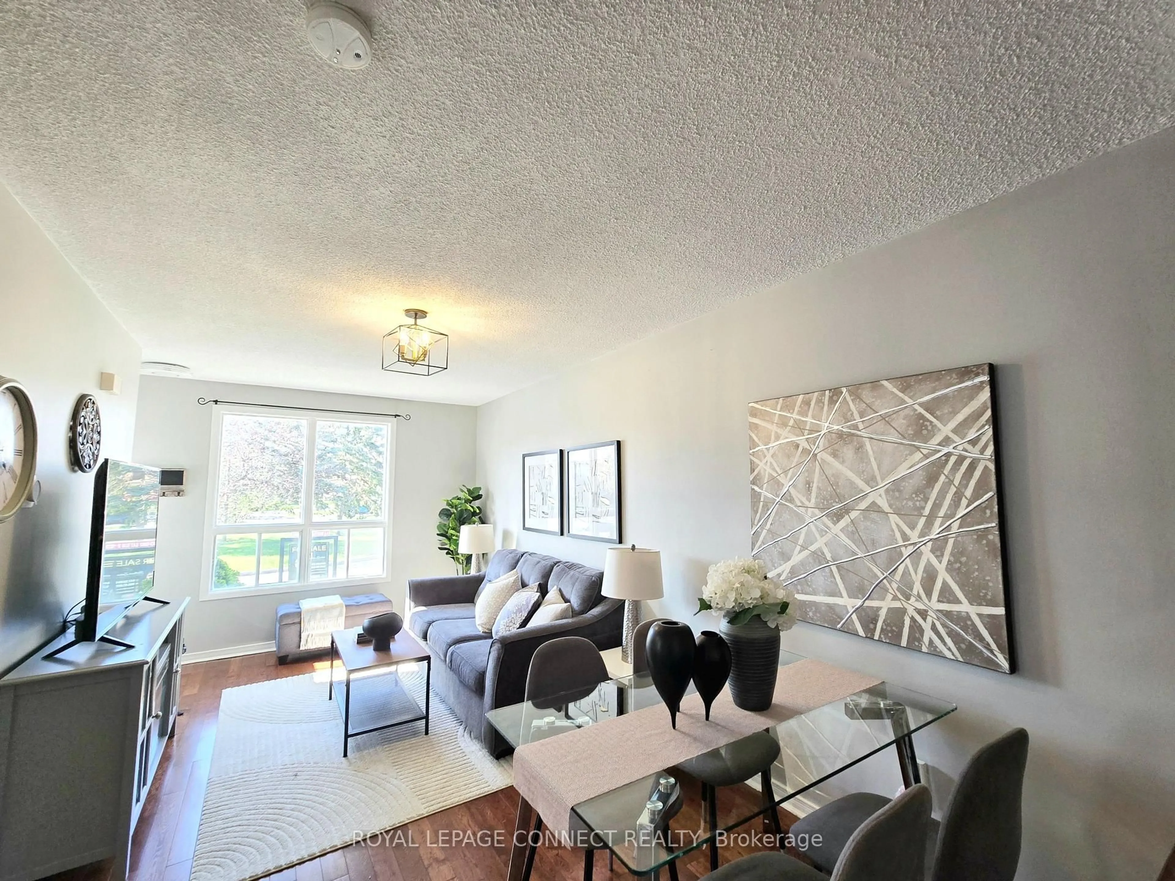 Living room with furniture, wood/laminate floor for 421 Pompano Crt, Oshawa Ontario L1K 1M9