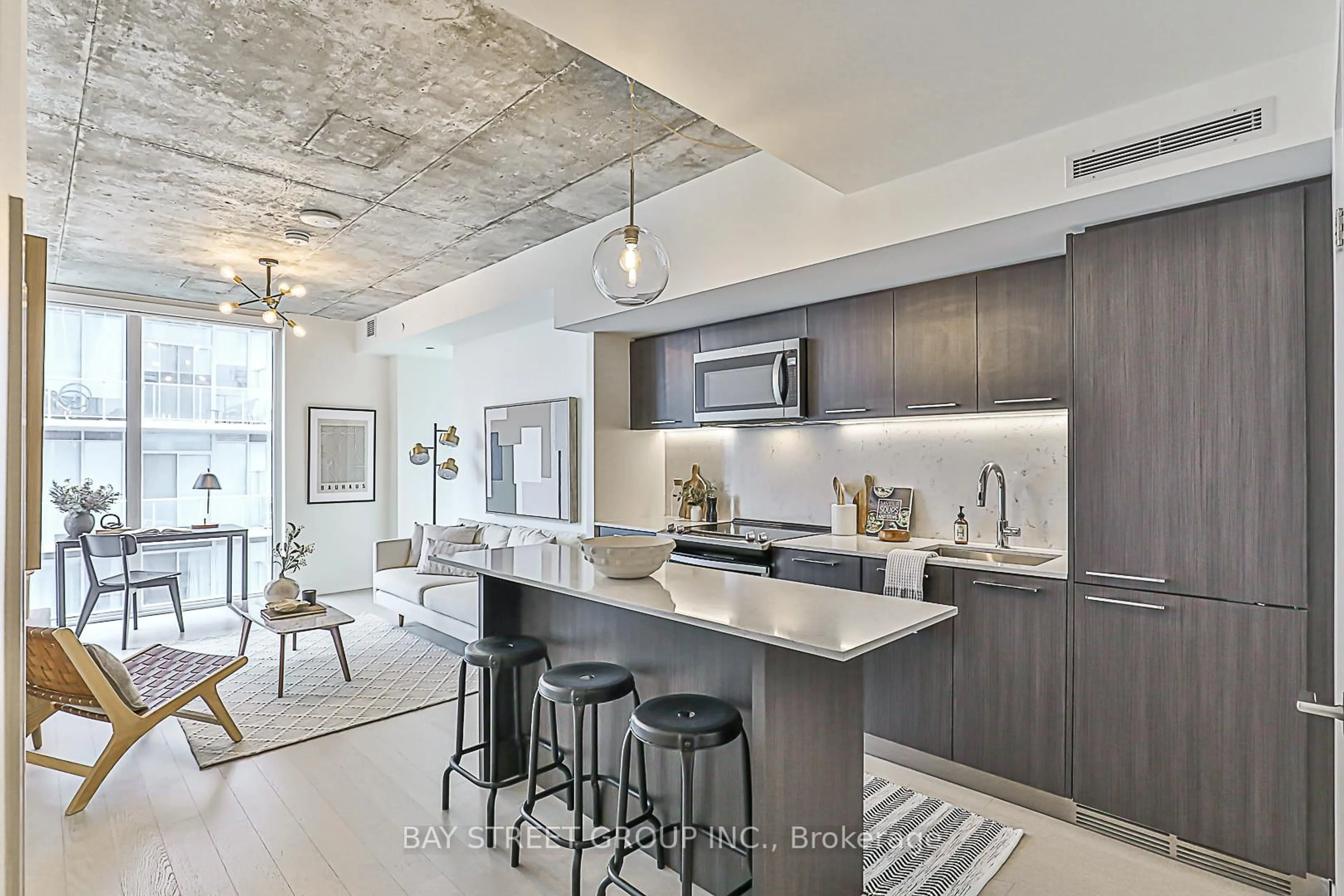 Open concept kitchen, cement floor for 15 Baseball Pl #1001, Toronto Ontario M4M 0E6