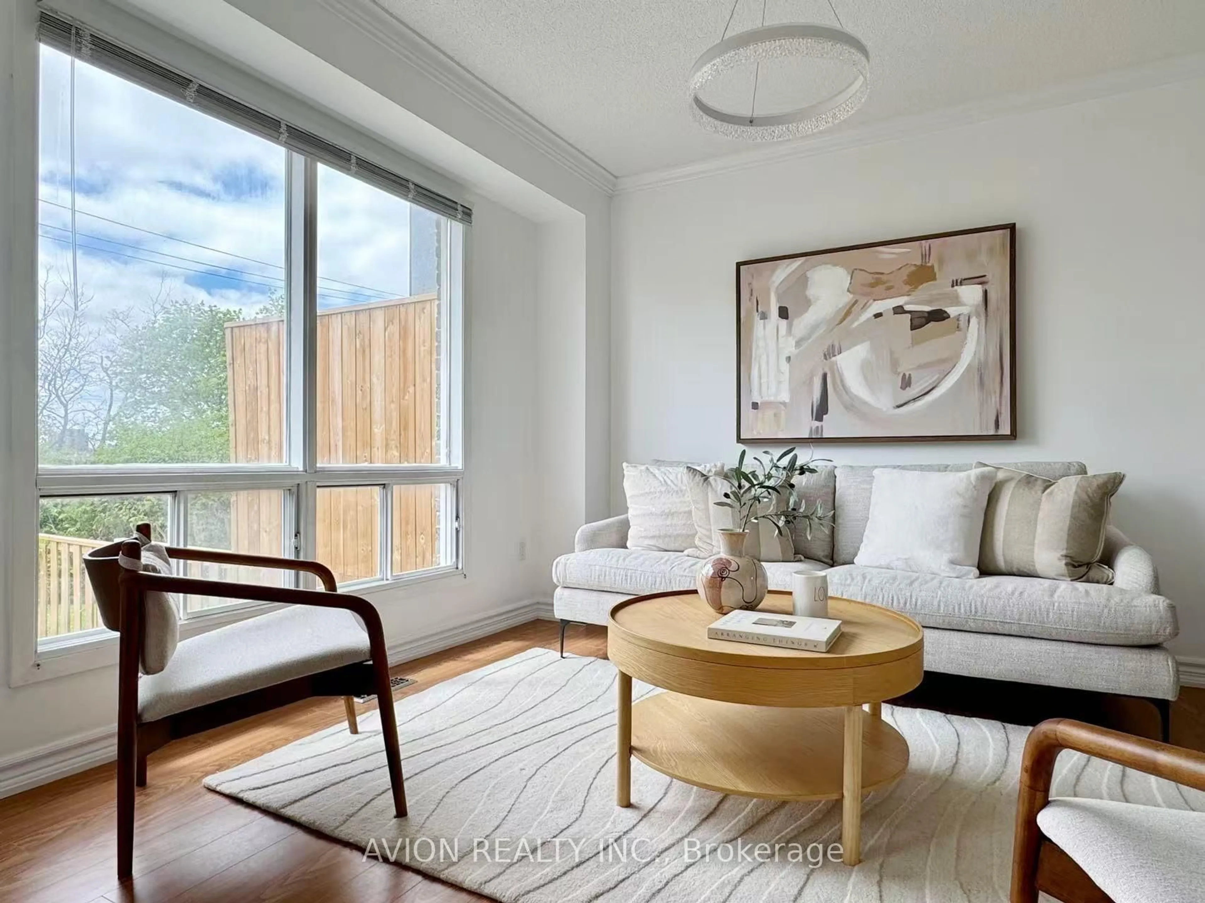 Living room with furniture, wood/laminate floor for 16 Glencoyne Cres, Toronto Ontario M1W 2Z2