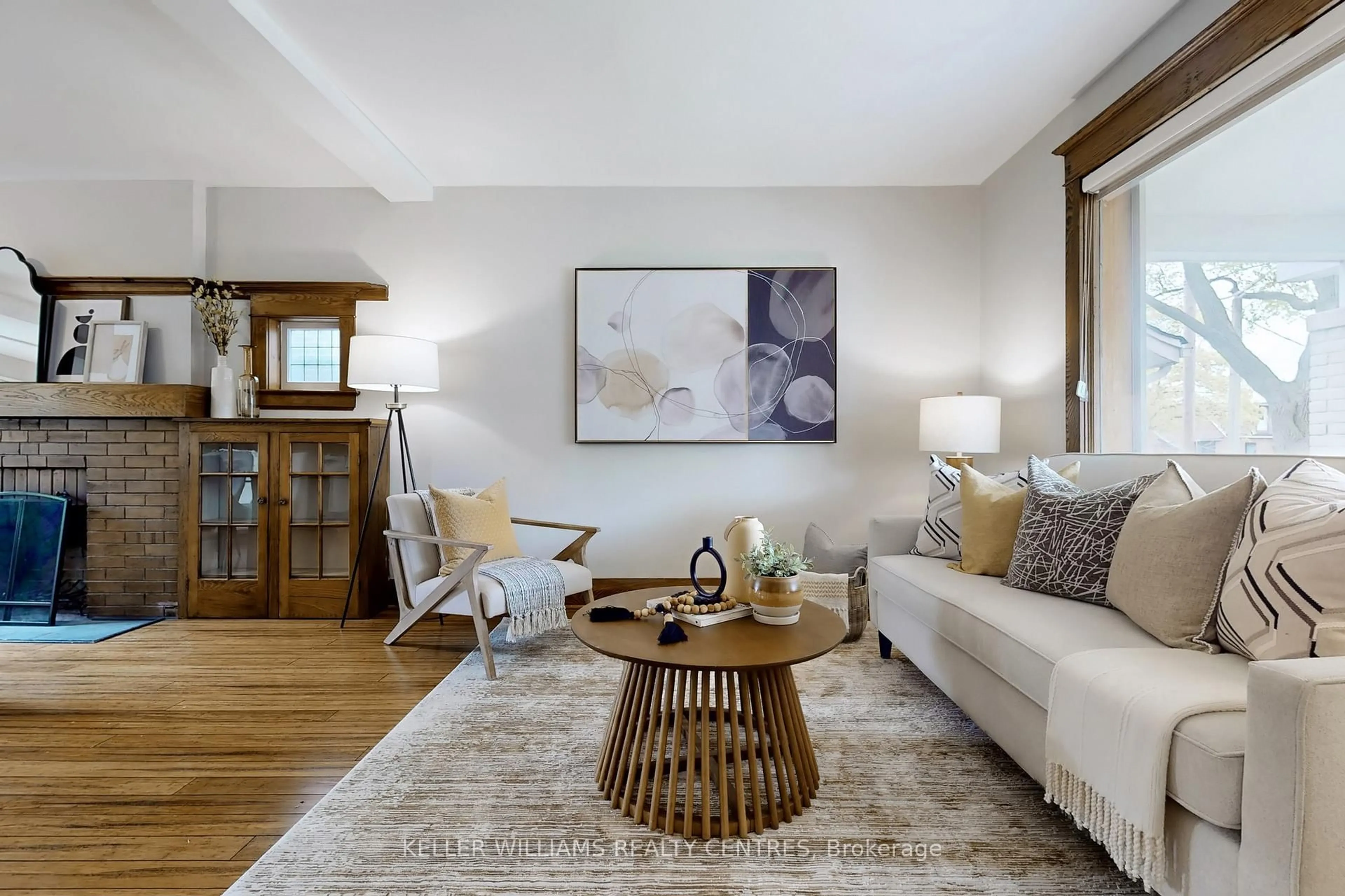 Living room with furniture, wood/laminate floor for 177 Brookside Dr, Toronto Ontario M4E 2M5