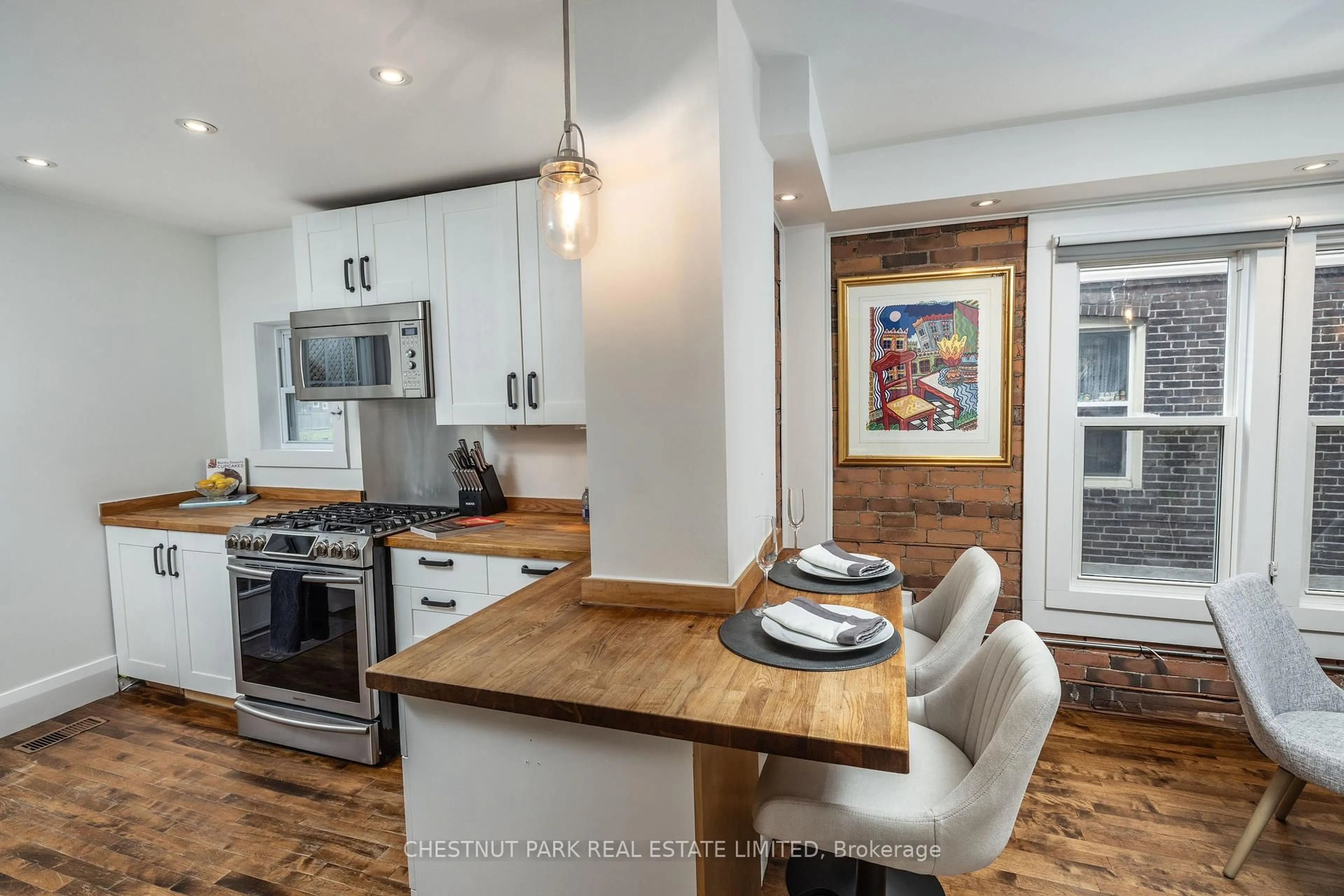 Open concept kitchen, wood/laminate floor for 24 Hiltz Ave, Toronto Ontario M4L 2N5