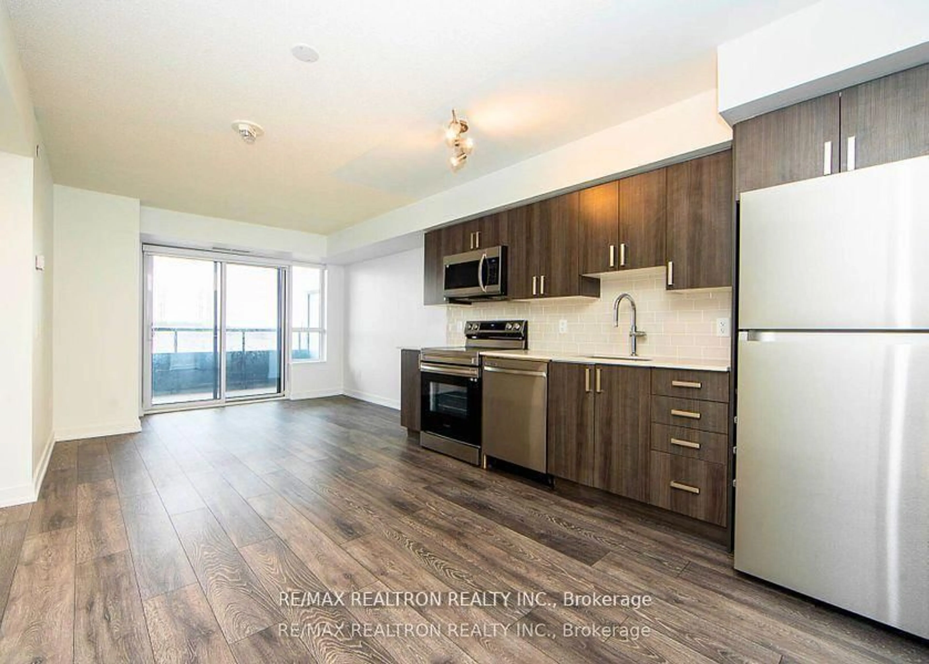 Open concept kitchen, wood/laminate floor for 1455 Celebration Dr #502, Pickering Ontario L1W 0C4