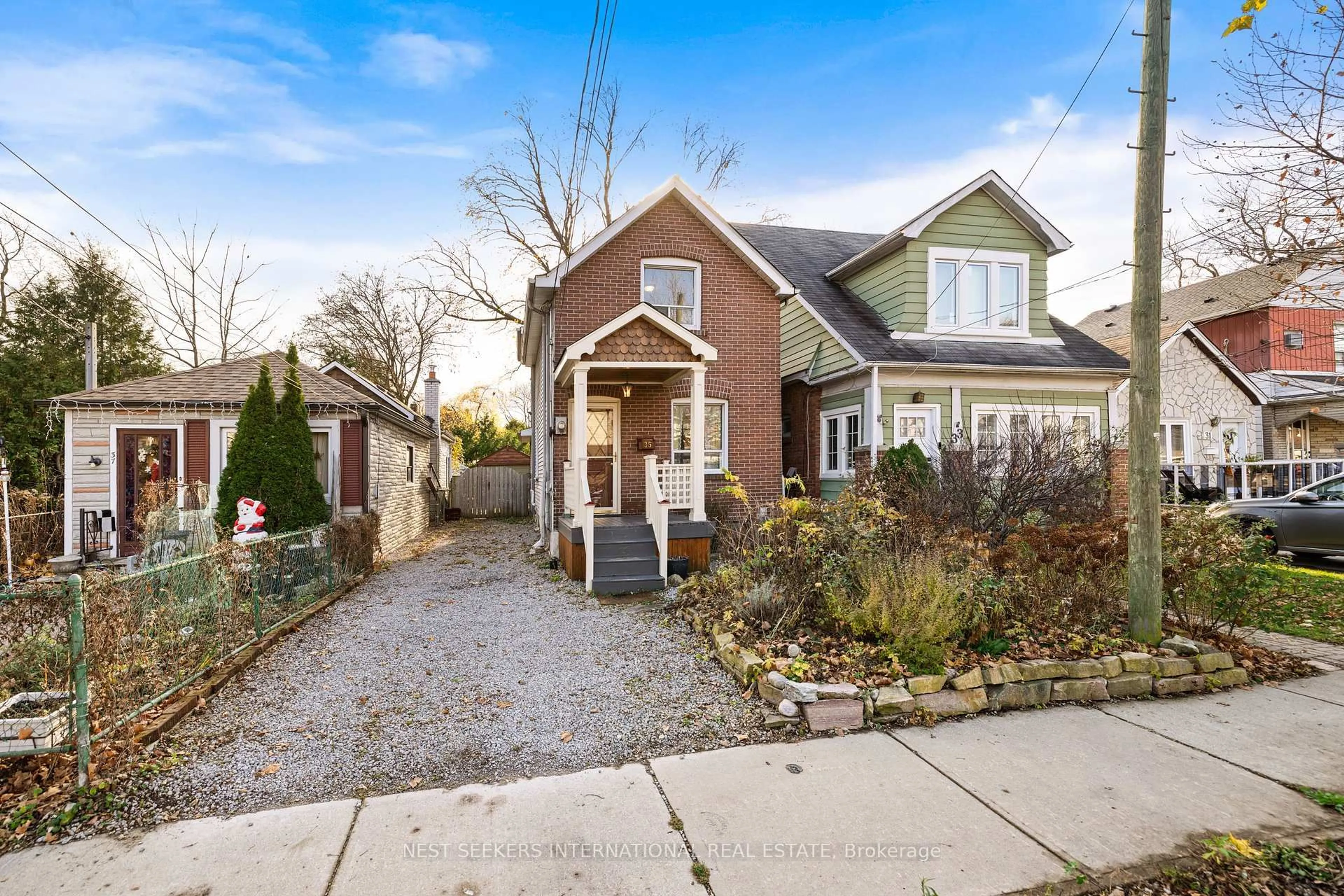 Home with brick exterior material, street for 35 Cambrai Ave, Toronto Ontario M4C 2P7