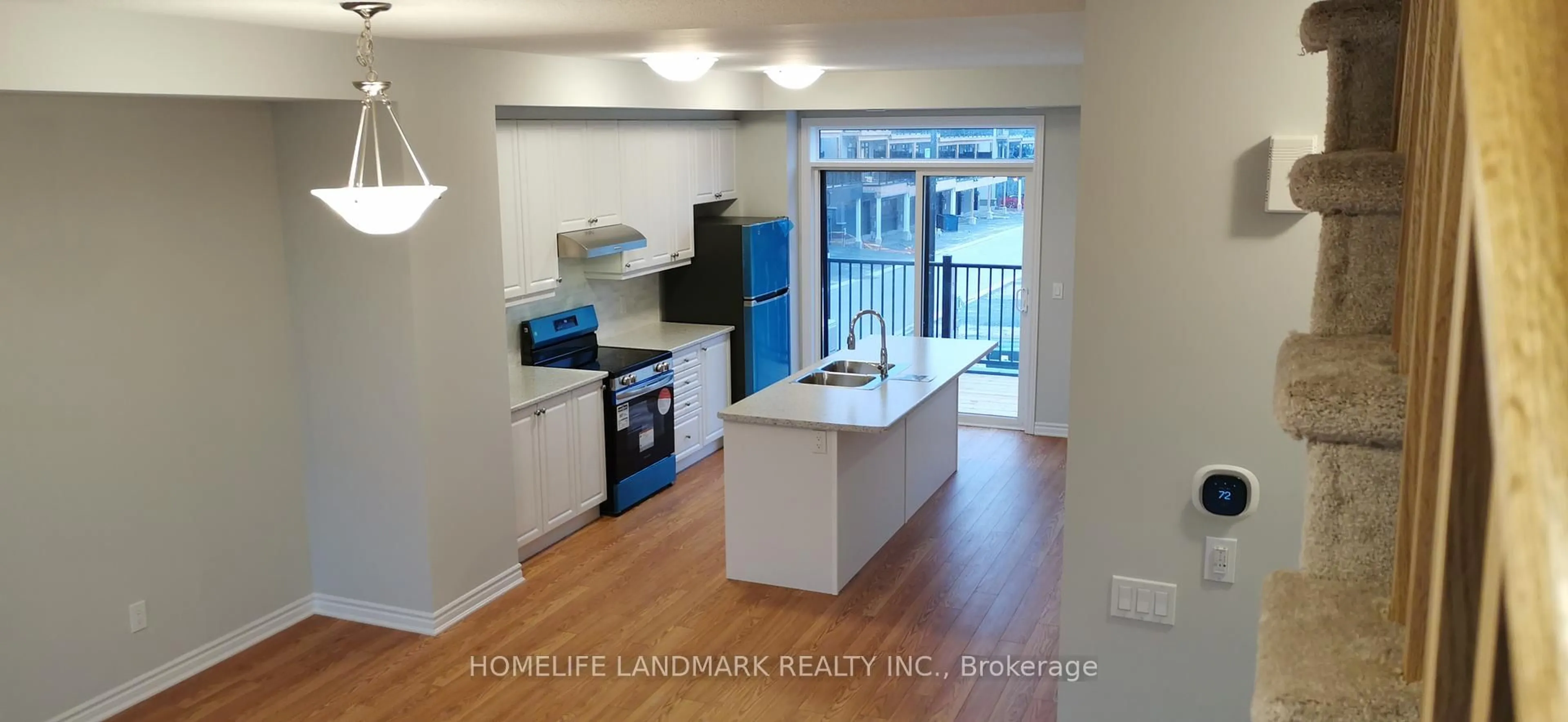 Open concept kitchen, wood/laminate floor for 2428 Harmony Rd, Oshawa Ontario L1H 8L7