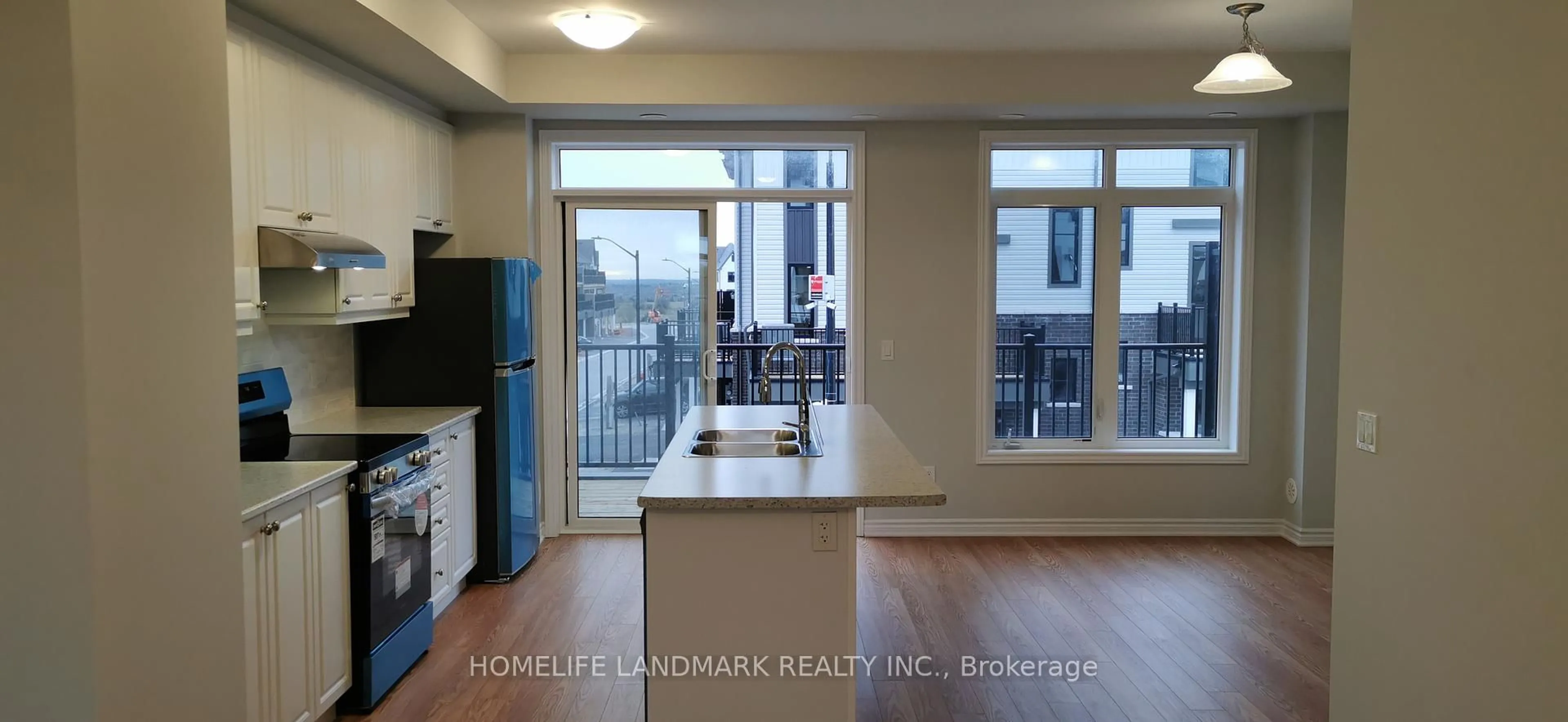 Open concept kitchen, wood/laminate floor for 2428 Harmony Rd, Oshawa Ontario L1H 8L7