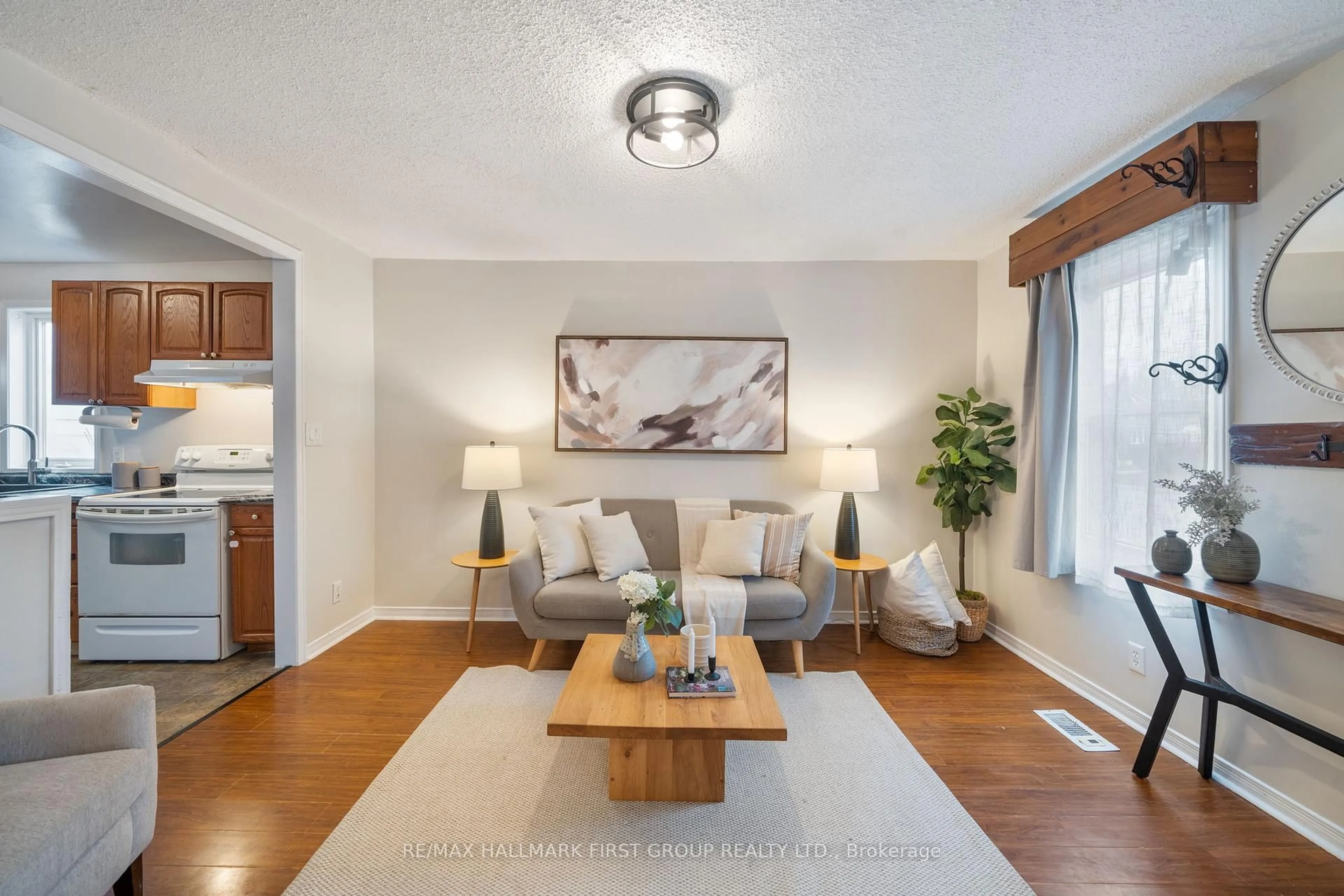 Living room with furniture, wood/laminate floor for 283 Park Rd, Oshawa Ontario L1J 4H4
