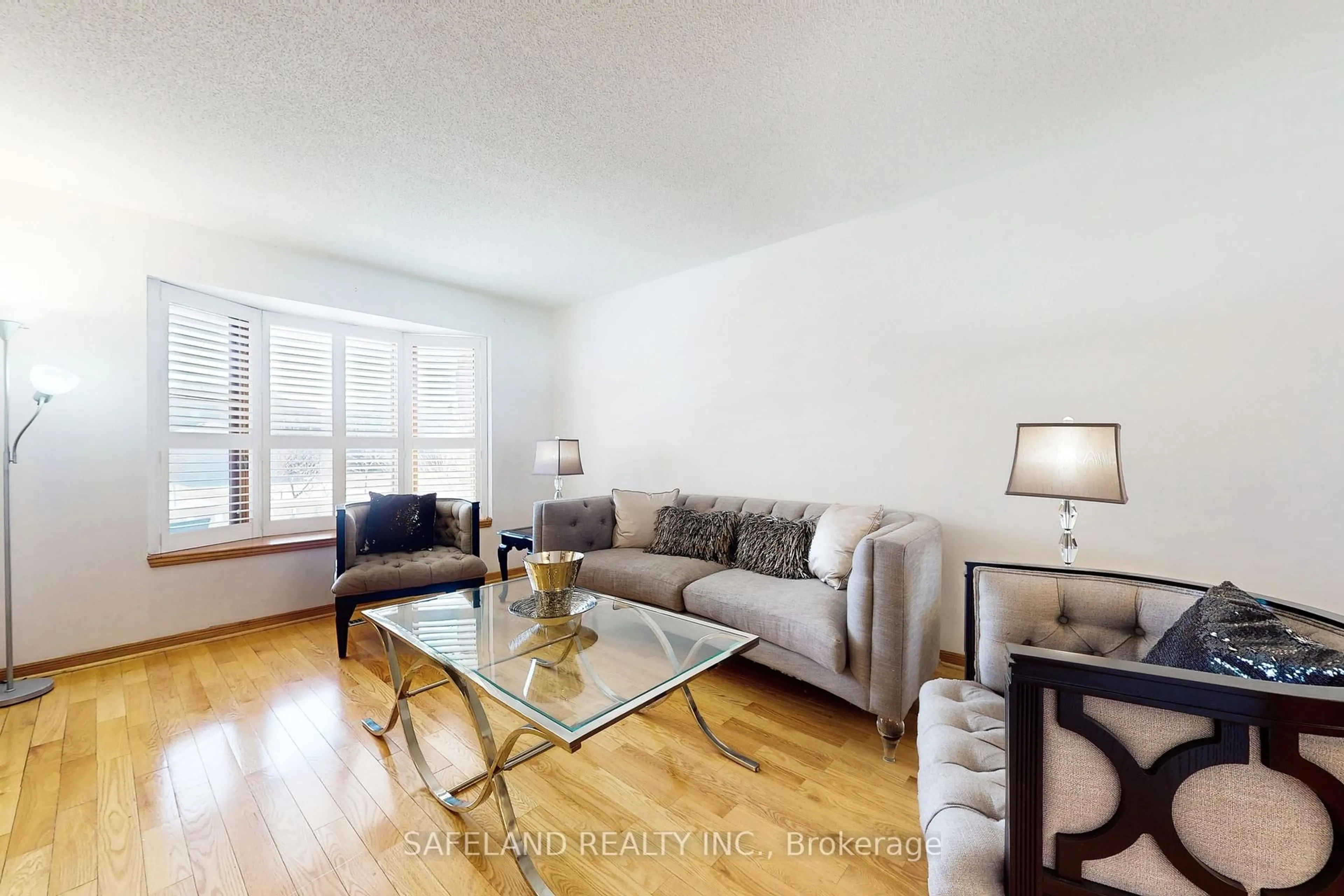 Living room with furniture, wood/laminate floor for 4 Intrepid Dr, Whitby Ontario L1N 8R7