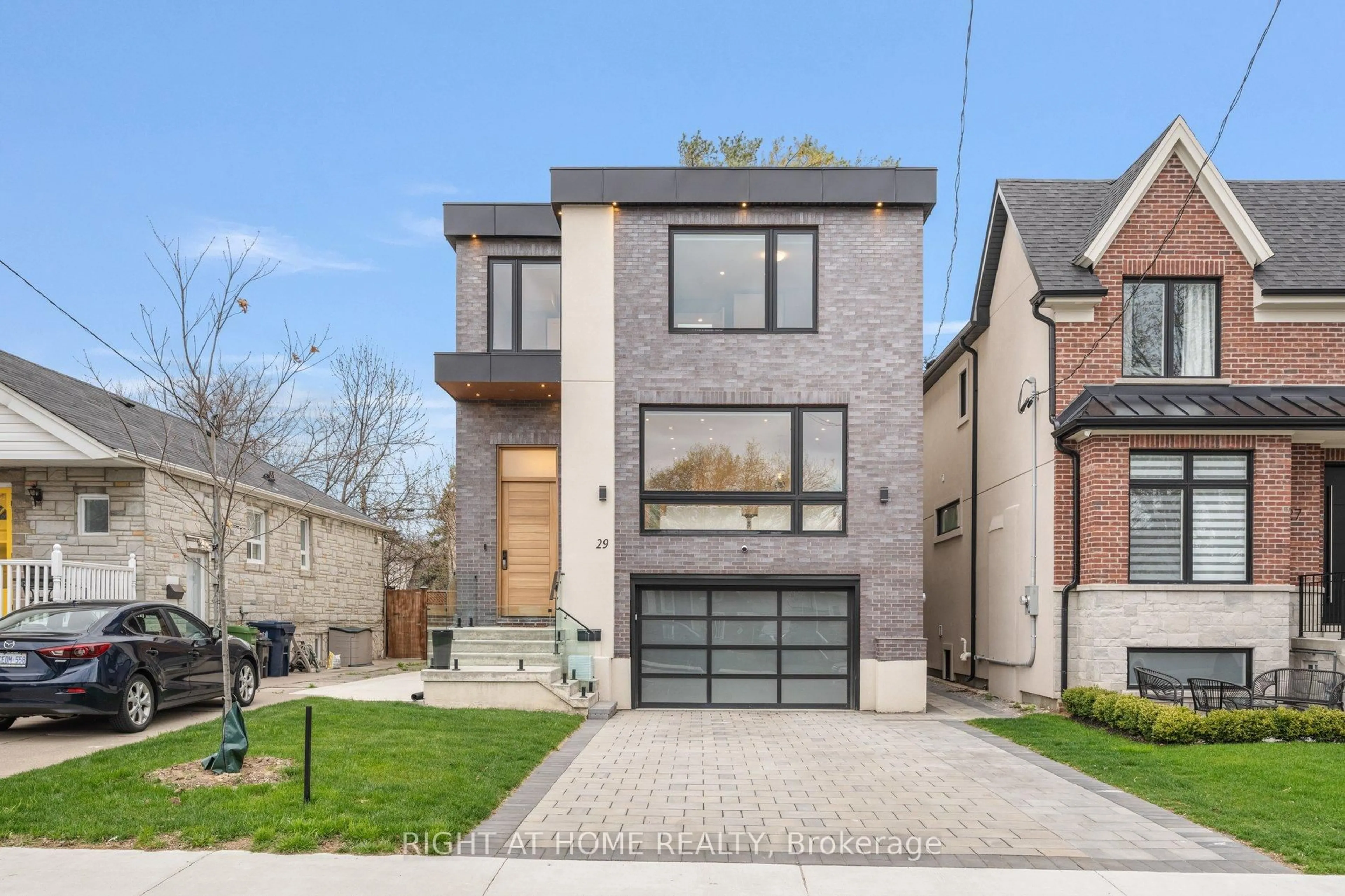 Home with brick exterior material, street for 29 Machockie Rd, Toronto Ontario M4C 3M5