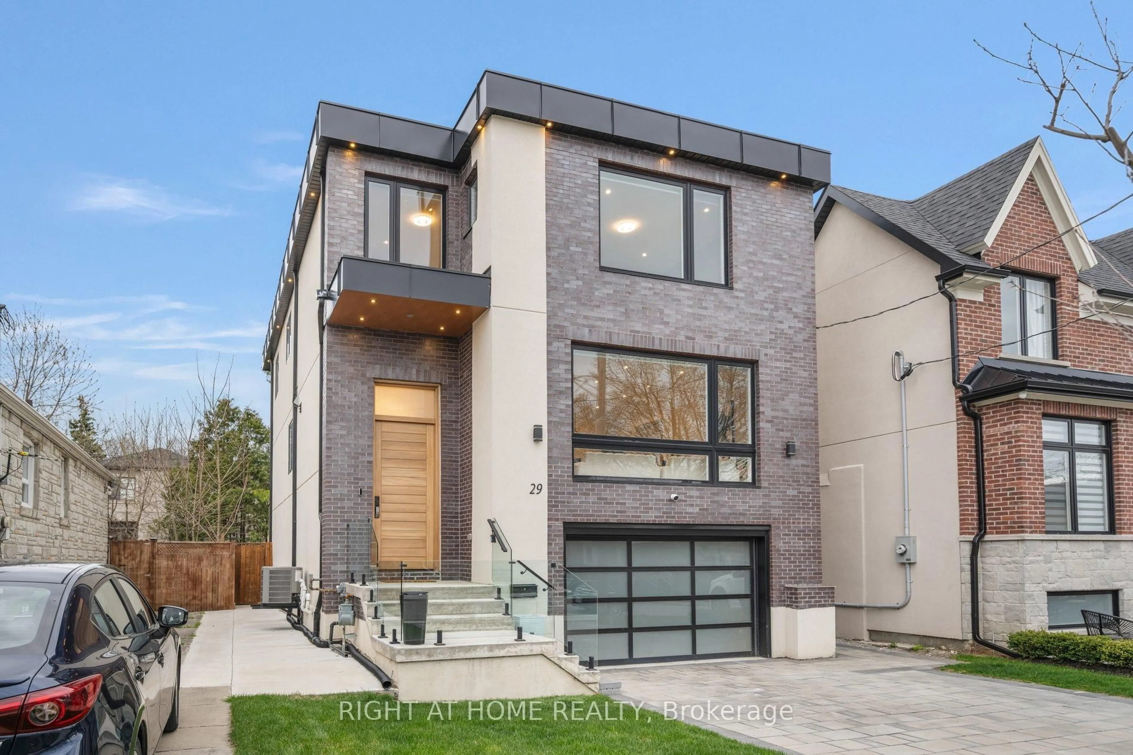 Home with brick exterior material, street for 29 Machockie Rd, Toronto Ontario M4C 3M5