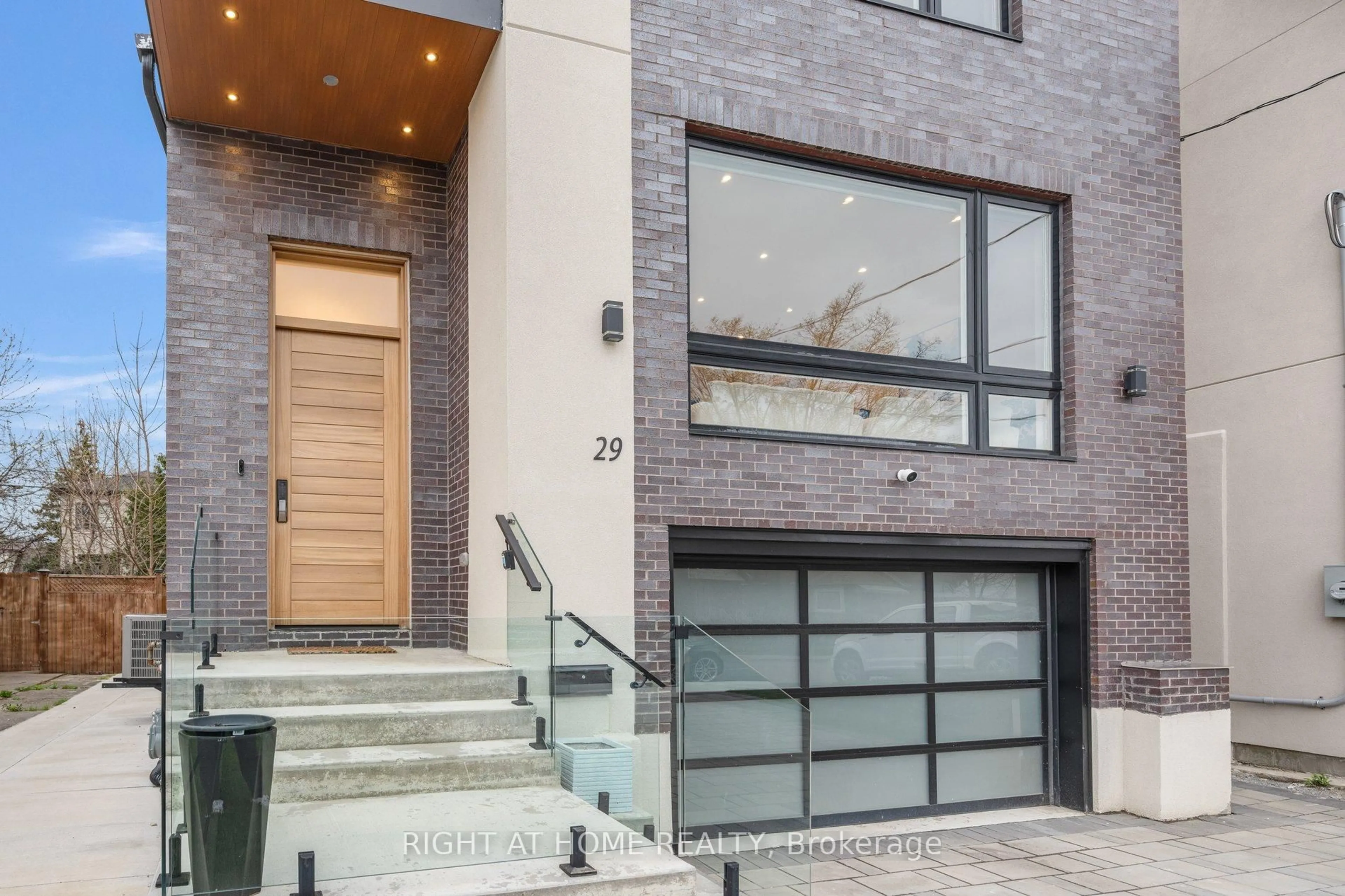 Home with brick exterior material, street for 29 Machockie Rd, Toronto Ontario M4C 3M5