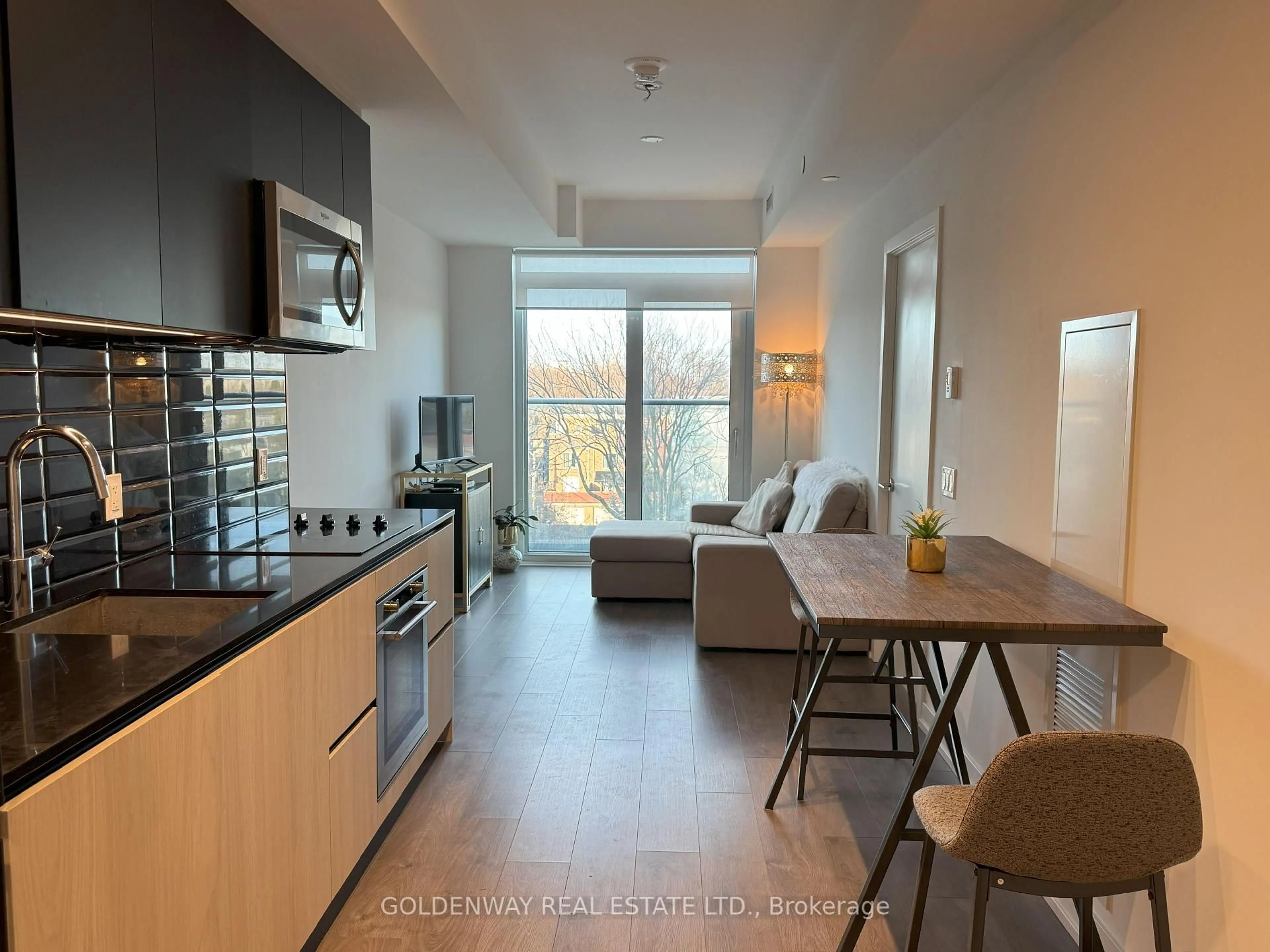 Open concept kitchen, wood/laminate floor for 150 Logan Ave #541, Toronto Ontario M4M 0E4