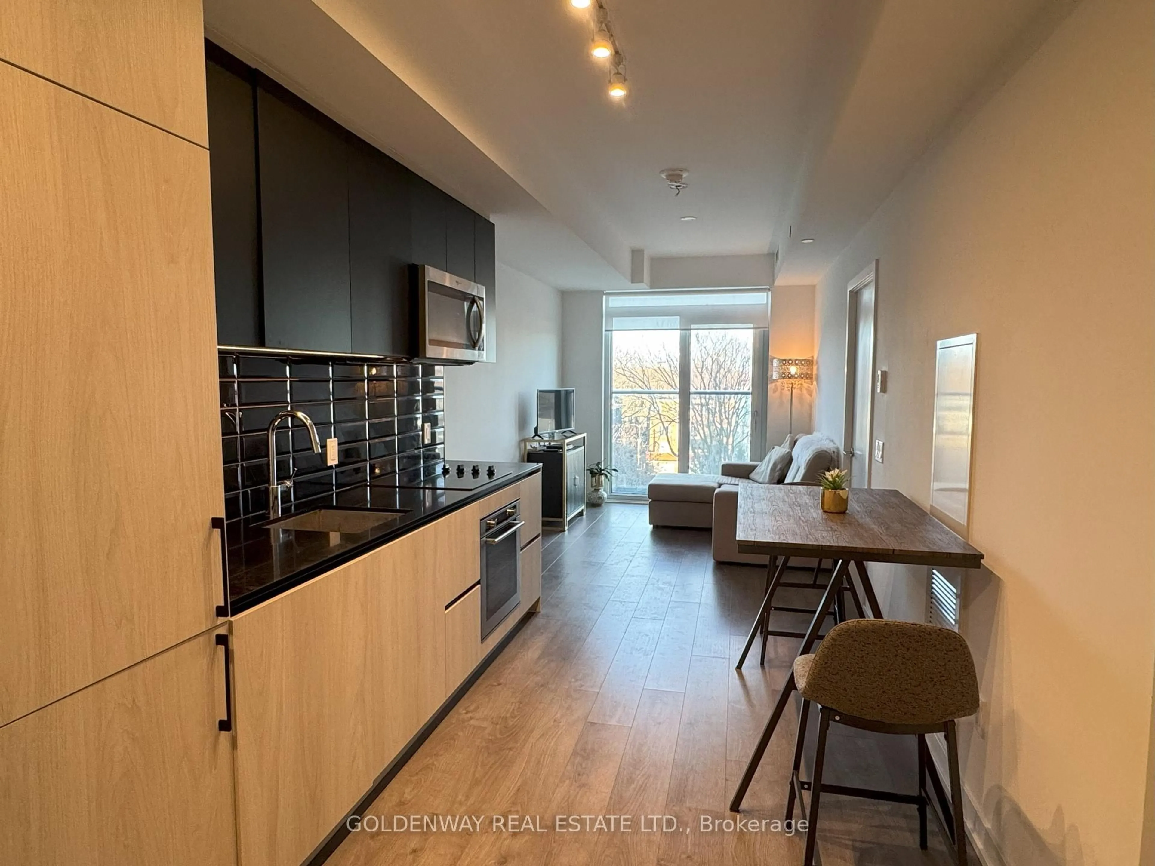 Open concept kitchen, wood/laminate floor for 150 Logan Ave #541, Toronto Ontario M4M 0E4
