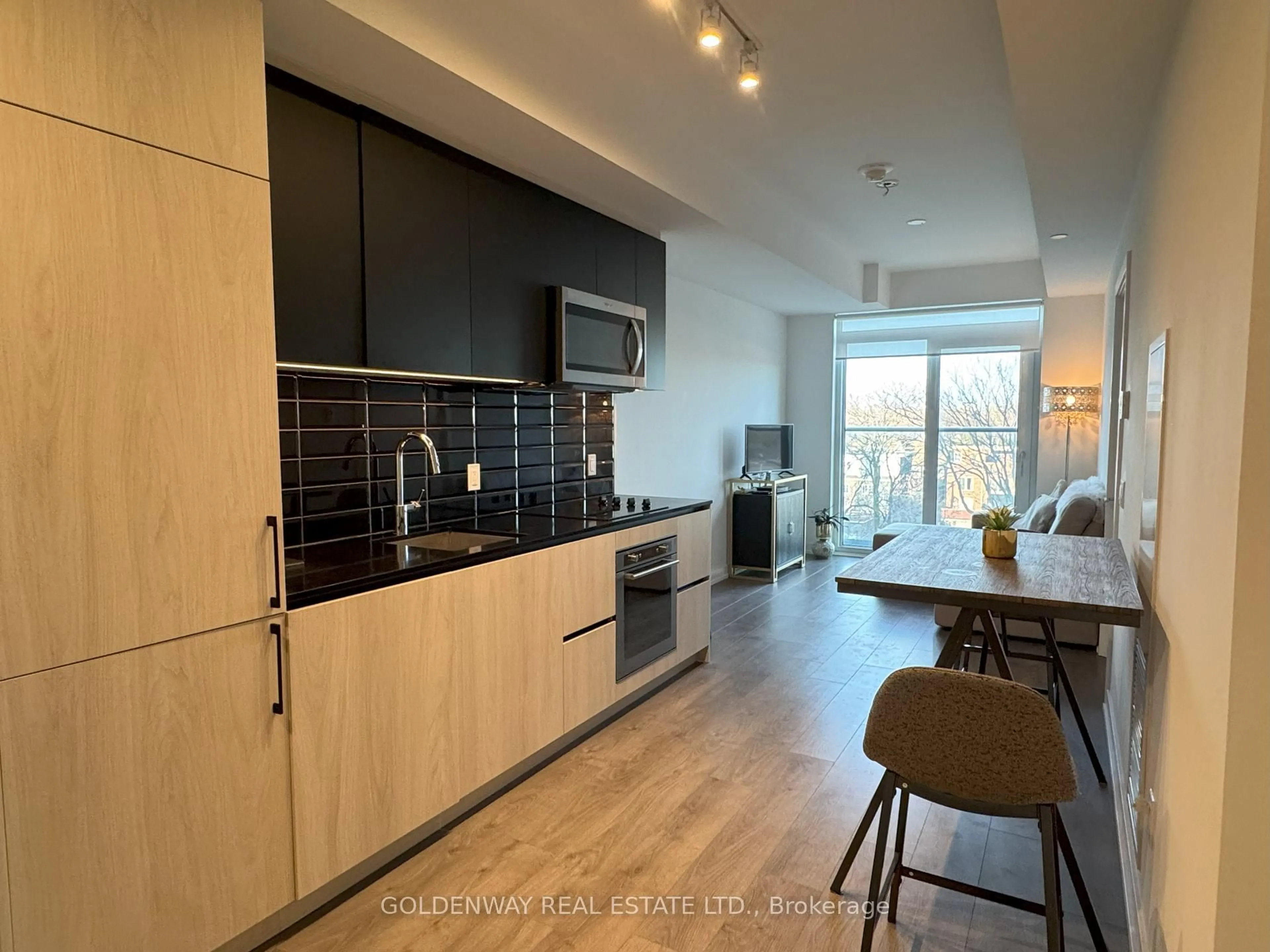 Open concept kitchen, wood/laminate floor for 150 Logan Ave #541, Toronto Ontario M4M 0E4