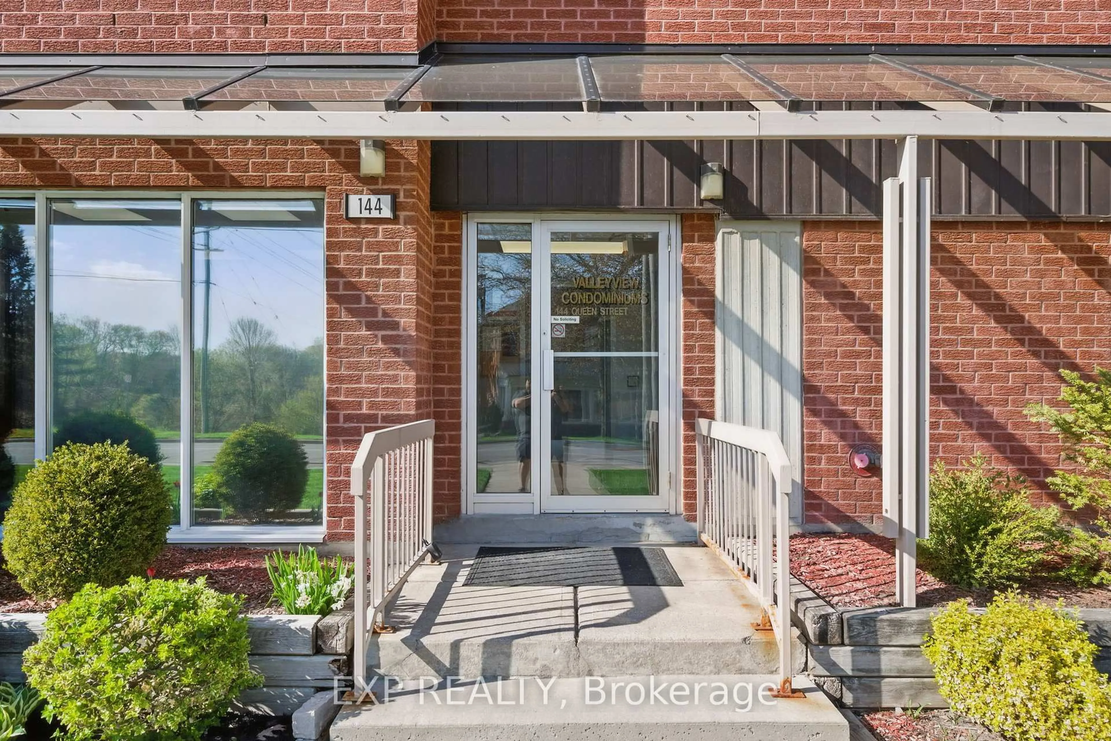 Home with brick exterior material, street for 144 Queen St #302, Clarington Ontario L1C 1M9