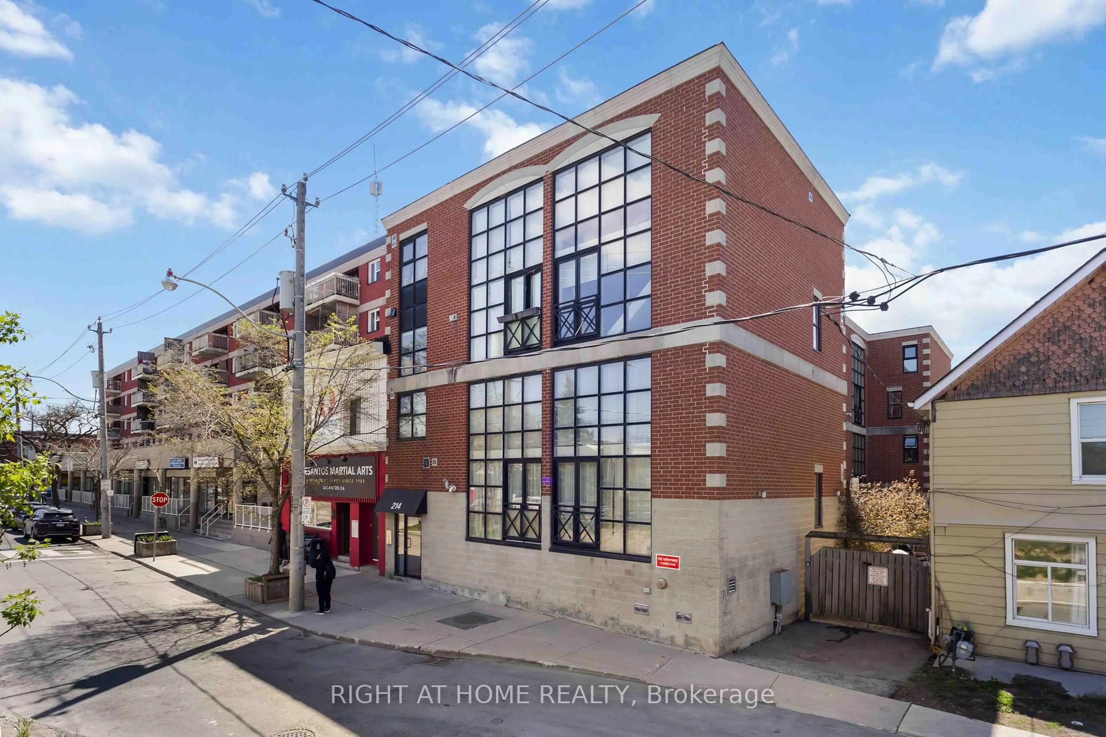 Home with brick exterior material, street for 214 Main St #202, Toronto Ontario M4E 2W1