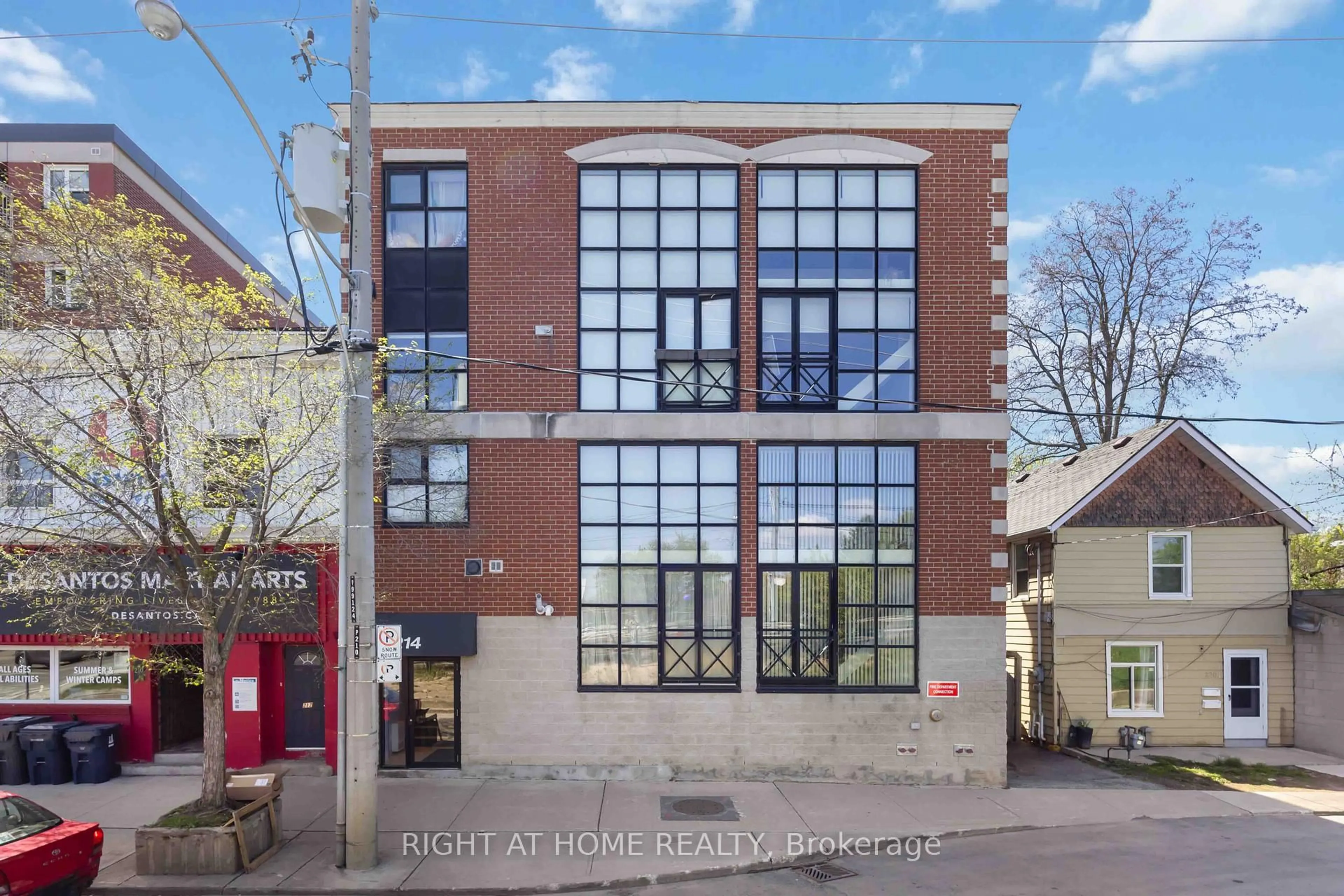 A pic from outside/outdoor area/front of a property/back of a property/a pic from drone, building for 214 Main St #202, Toronto Ontario M4E 2W1