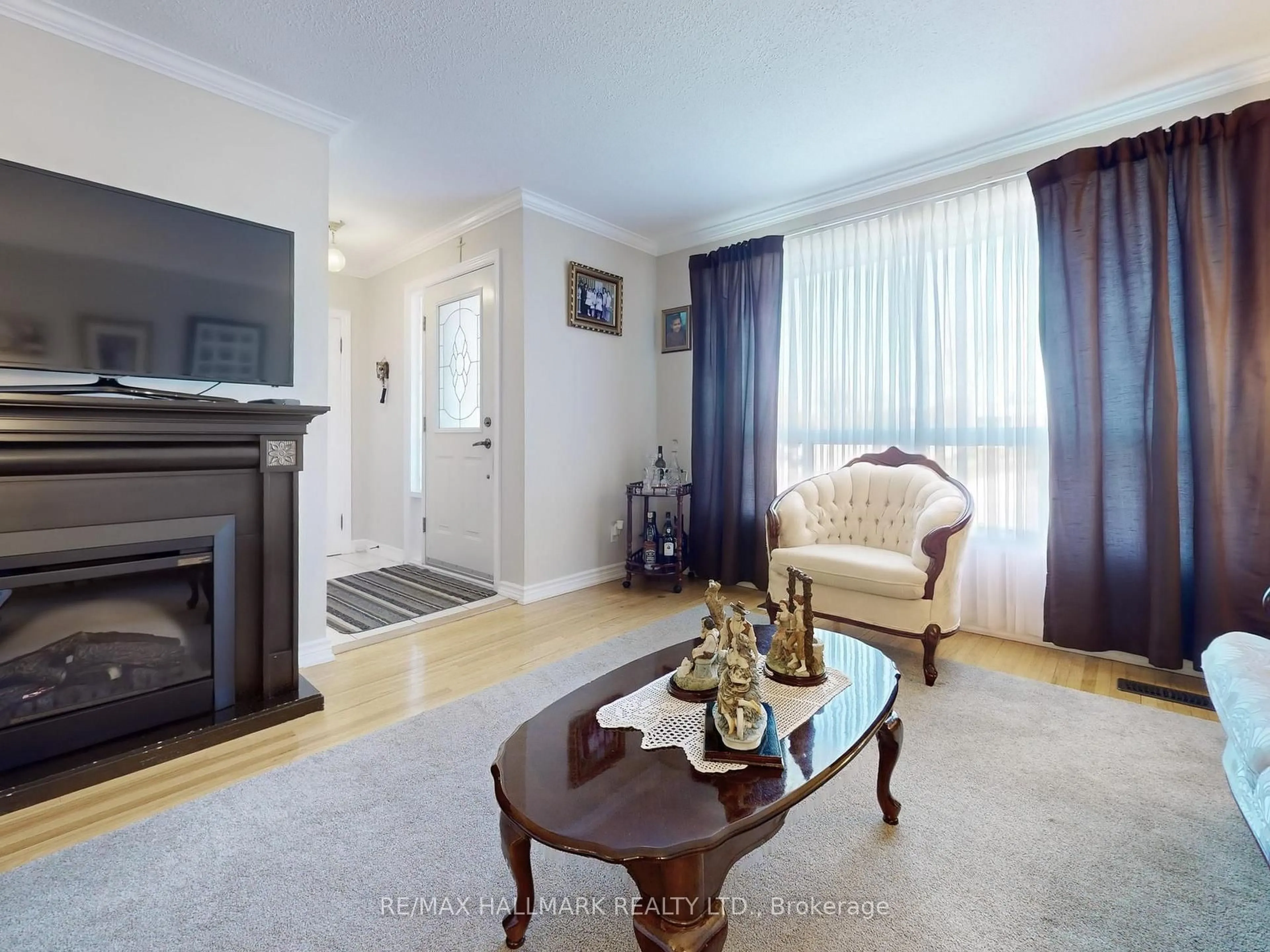 Living room with furniture, wood/laminate floor for 1399 Garvolin Ave, Pickering Ontario L1W 1J7