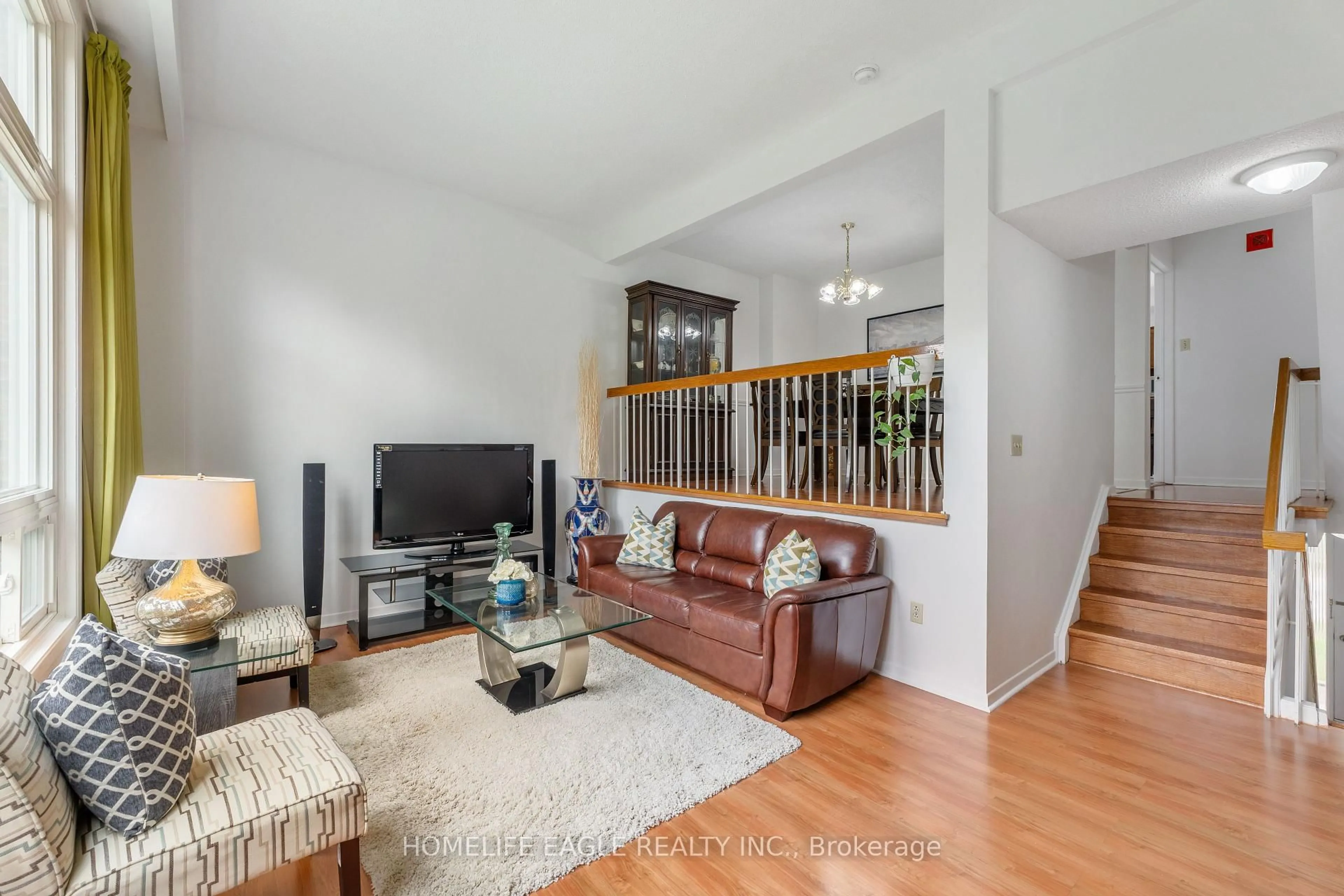 Living room with furniture, wood/laminate floor for 3000 Midland Ave #10, Toronto Ontario M1S 3T1