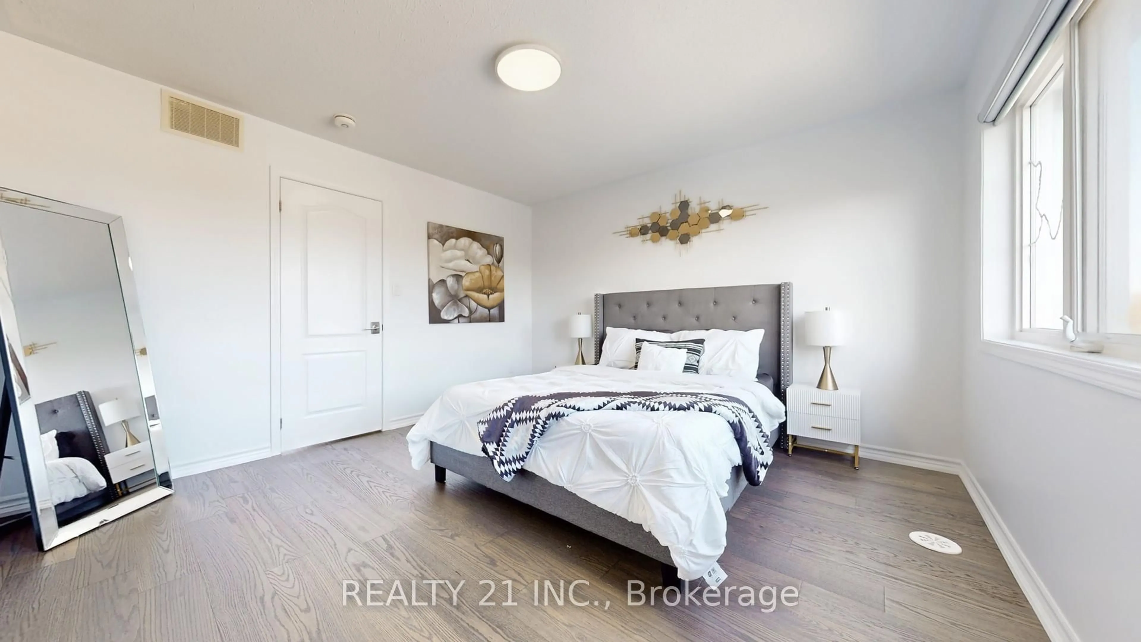 Bedroom with bed, wood/laminate floor for 42 Heron Park Pl Pl, Toronto Ontario M1E 0B8