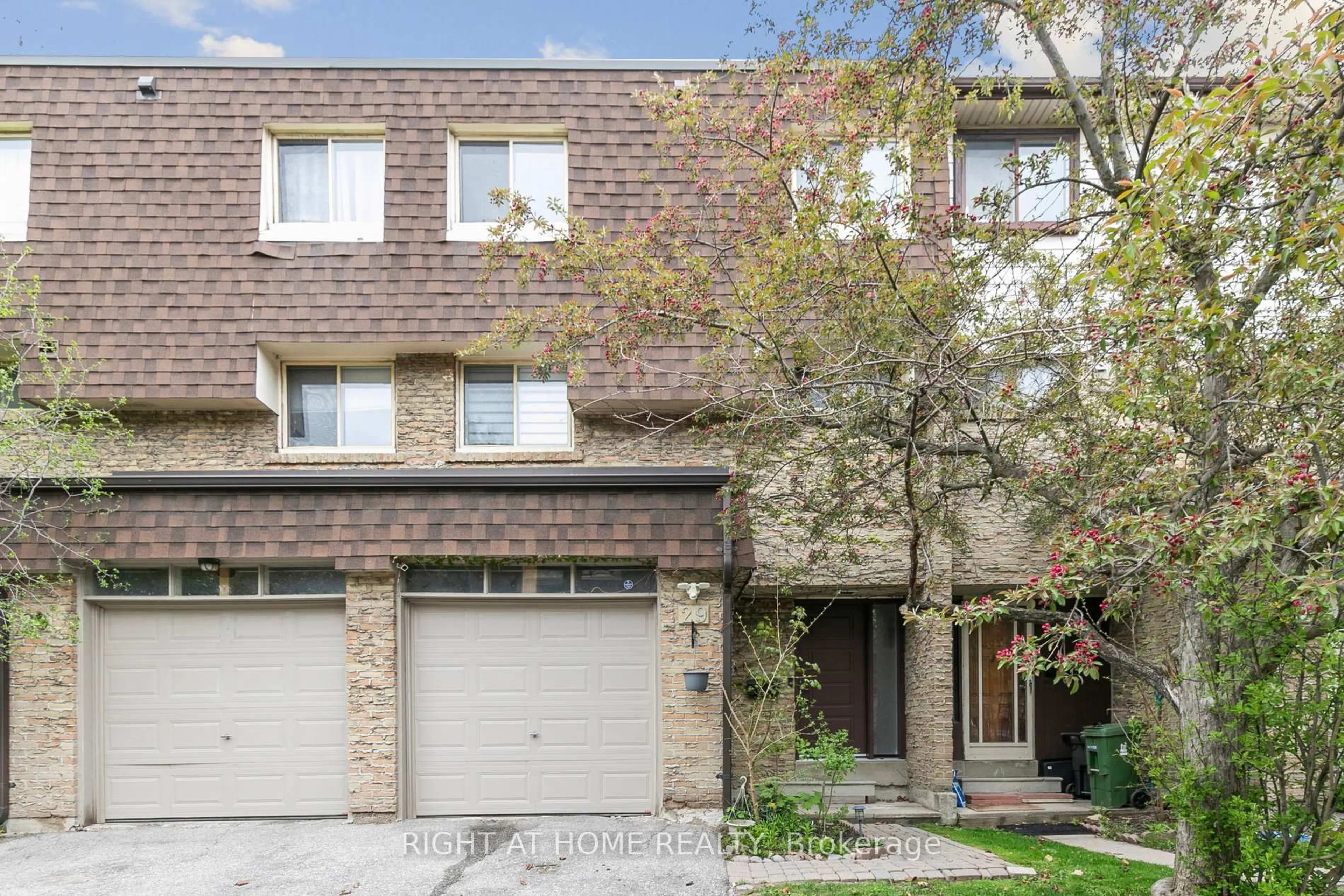Home with brick exterior material, street for 15 Huntingwood Dr #29, Toronto Ontario M1W 2L7