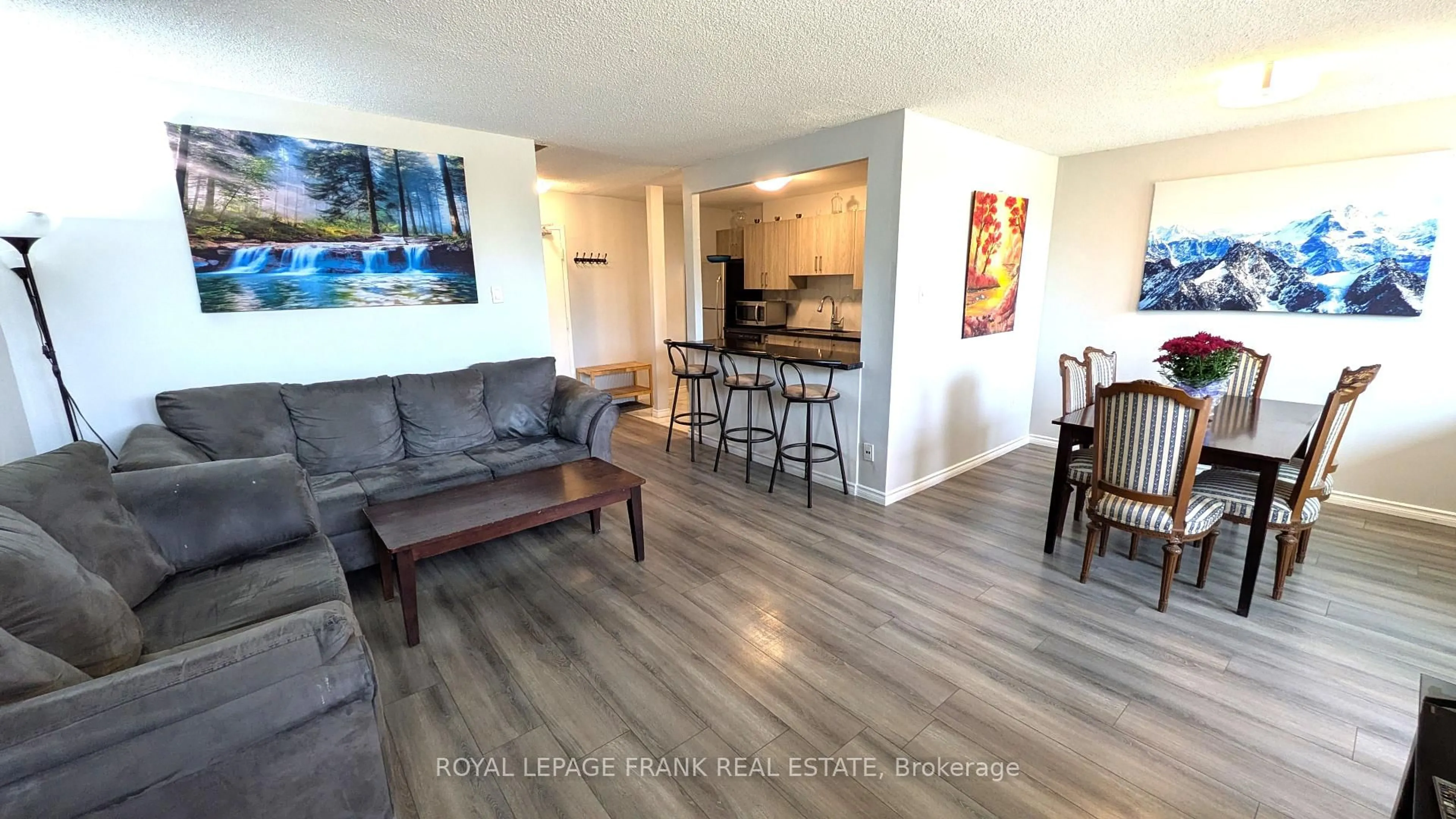 Living room with furniture, wood/laminate floor for 4060 Lawrence Ave #220, Toronto Ontario M1E 4V4