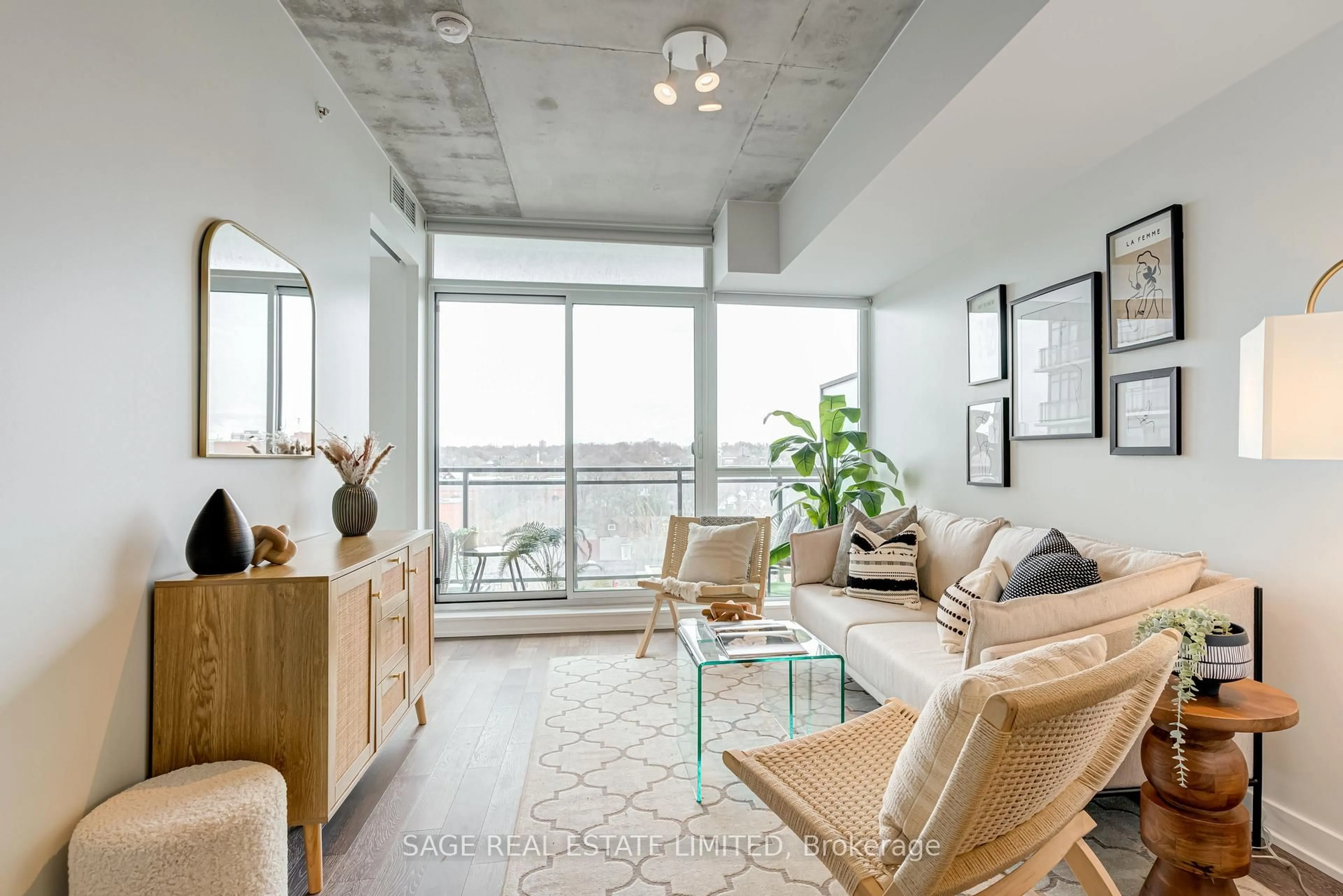 Living room with furniture, cement floor for 1190 Dundas St #804, Toronto Ontario M4M 0C5