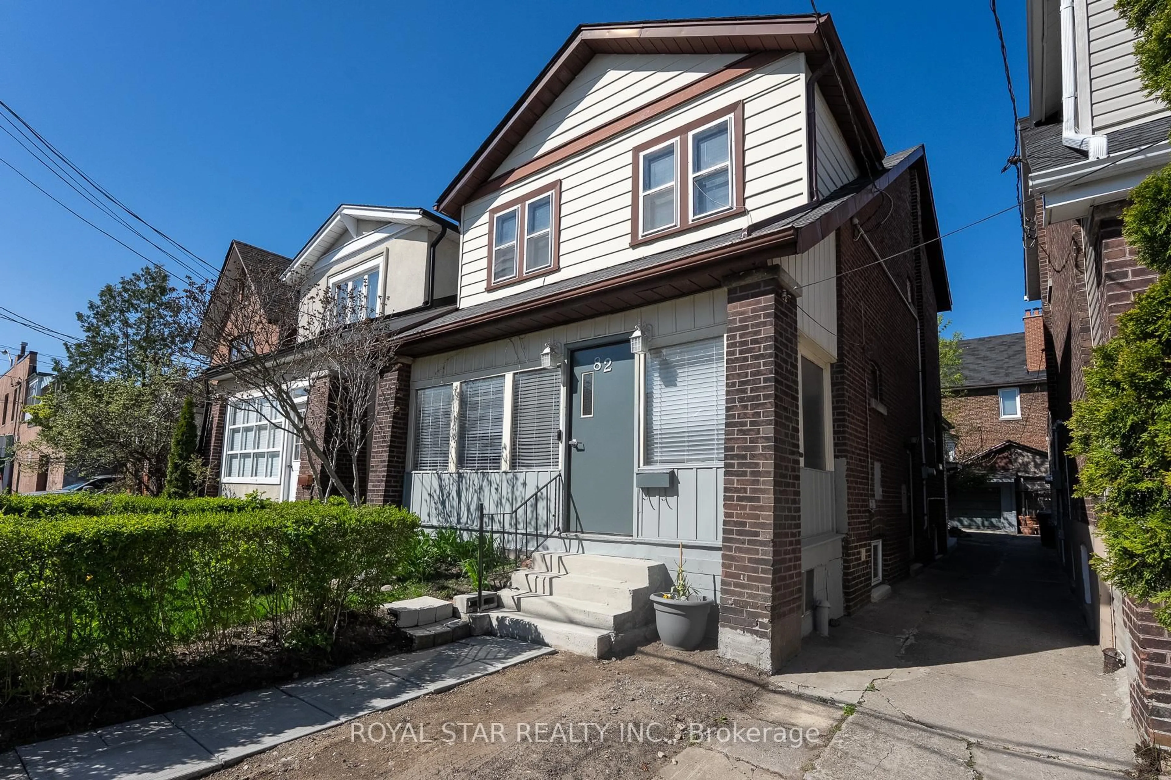 Home with vinyl exterior material, street for 82 Westlake Ave, Toronto Ontario M4C 4R1