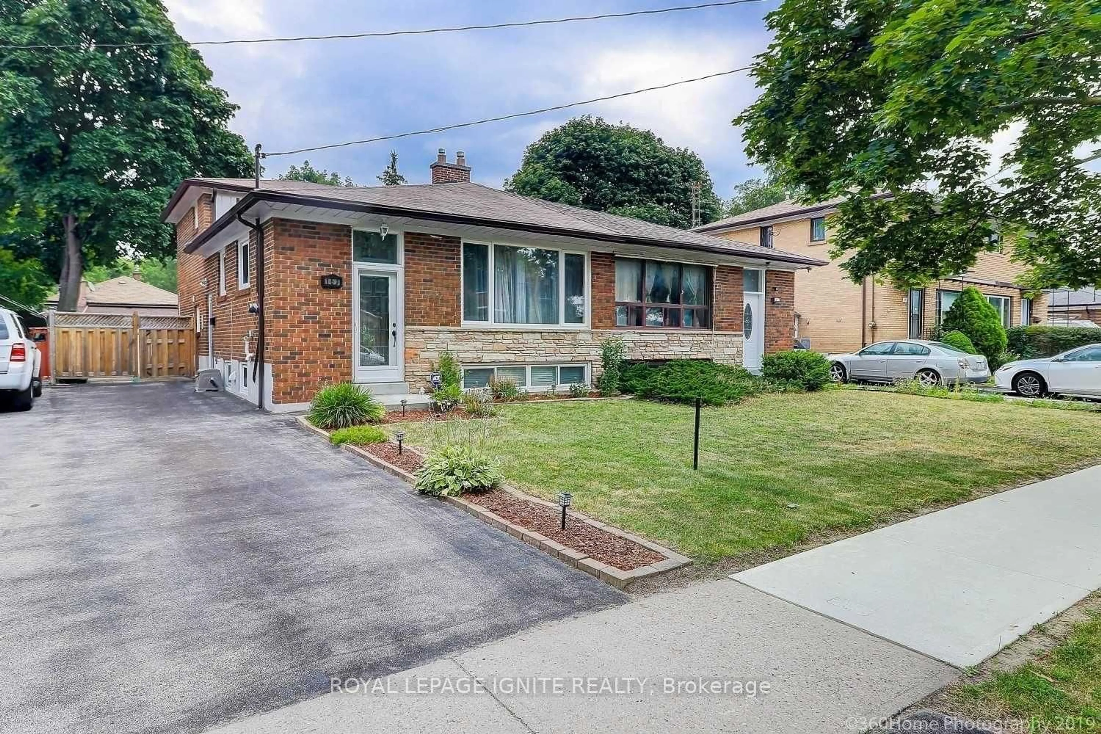 Home with brick exterior material, street for 153 Rodda Blvd, Toronto Ontario M1E 3A1
