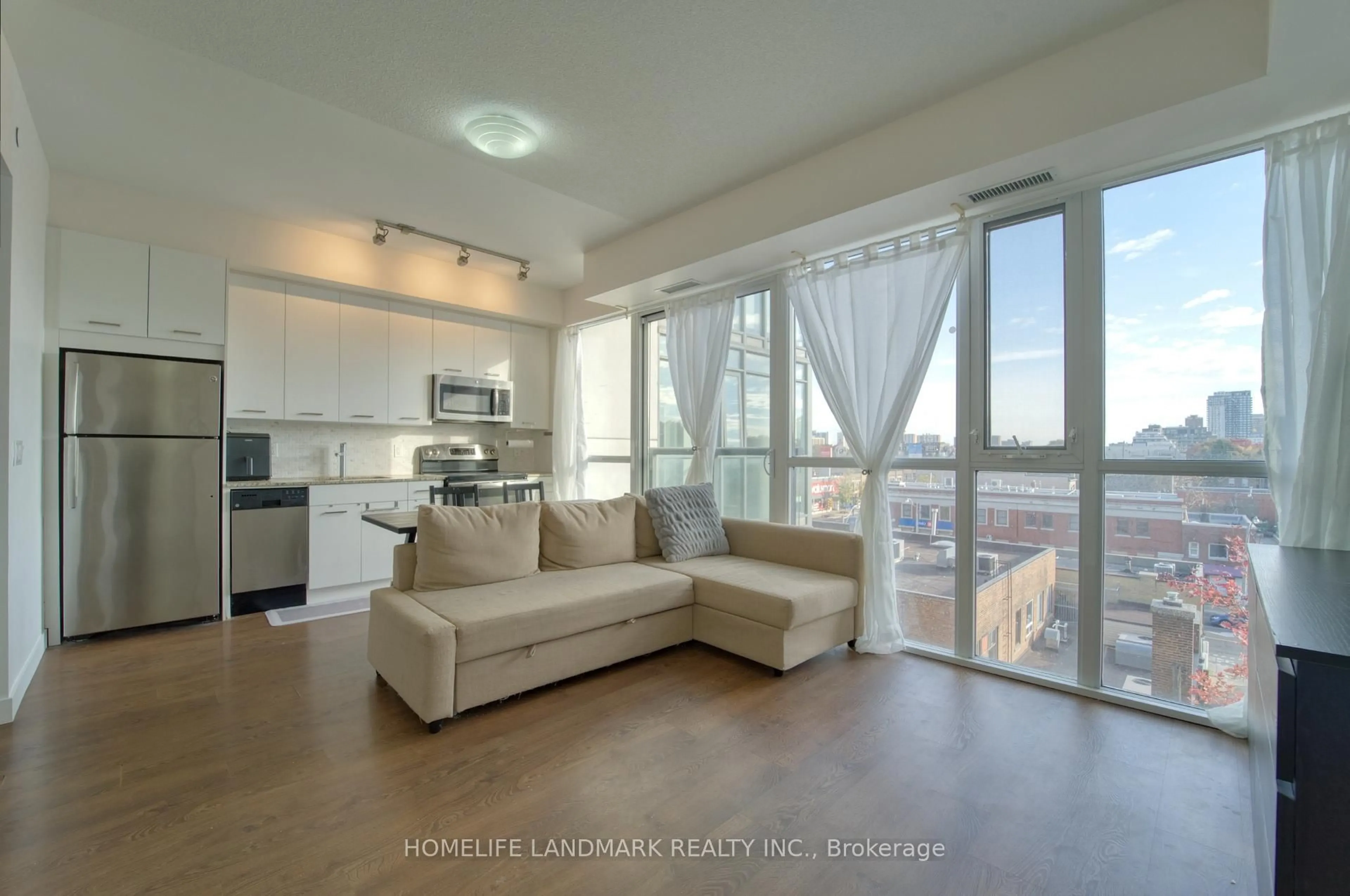 Living room with furniture, unknown for 2055 Danforth Ave #509, Toronto Ontario M4C 1J8