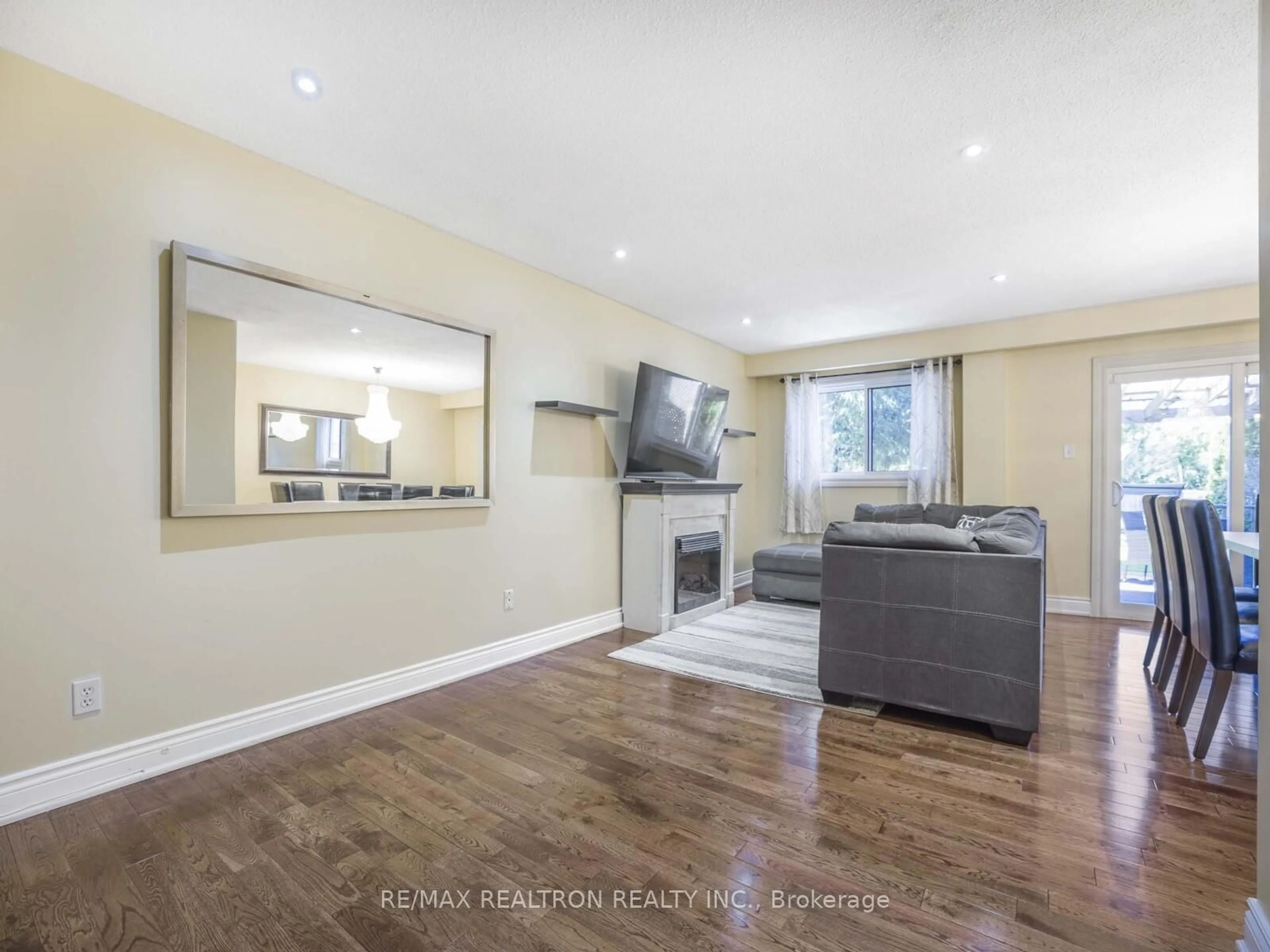 Living room with furniture, wood/laminate floor for 1980 Faylee Cres, Pickering Ontario L1V 2V6