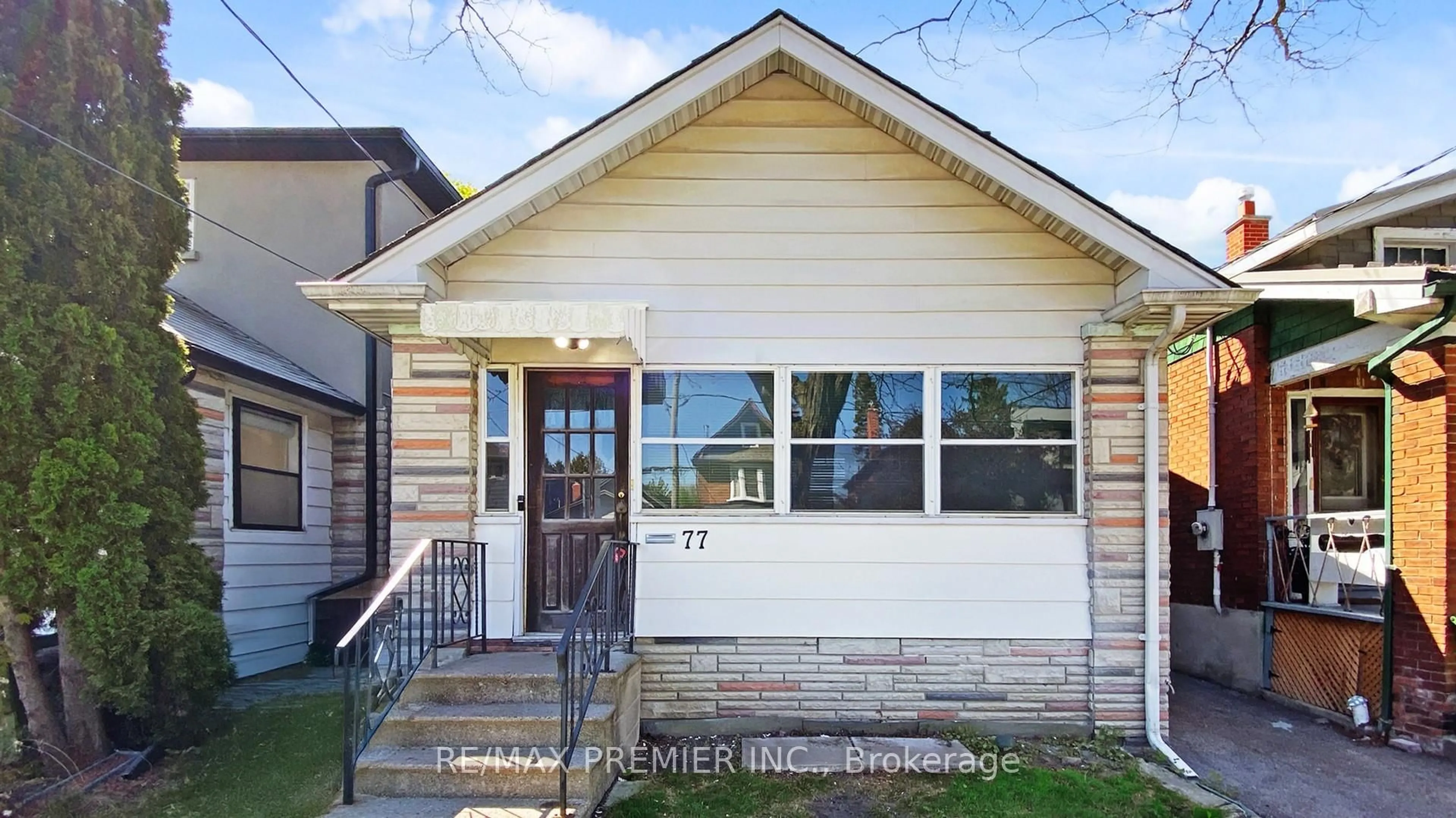 Home with vinyl exterior material, street for 77 Gatwick Ave, Toronto Ontario M4C 1W4