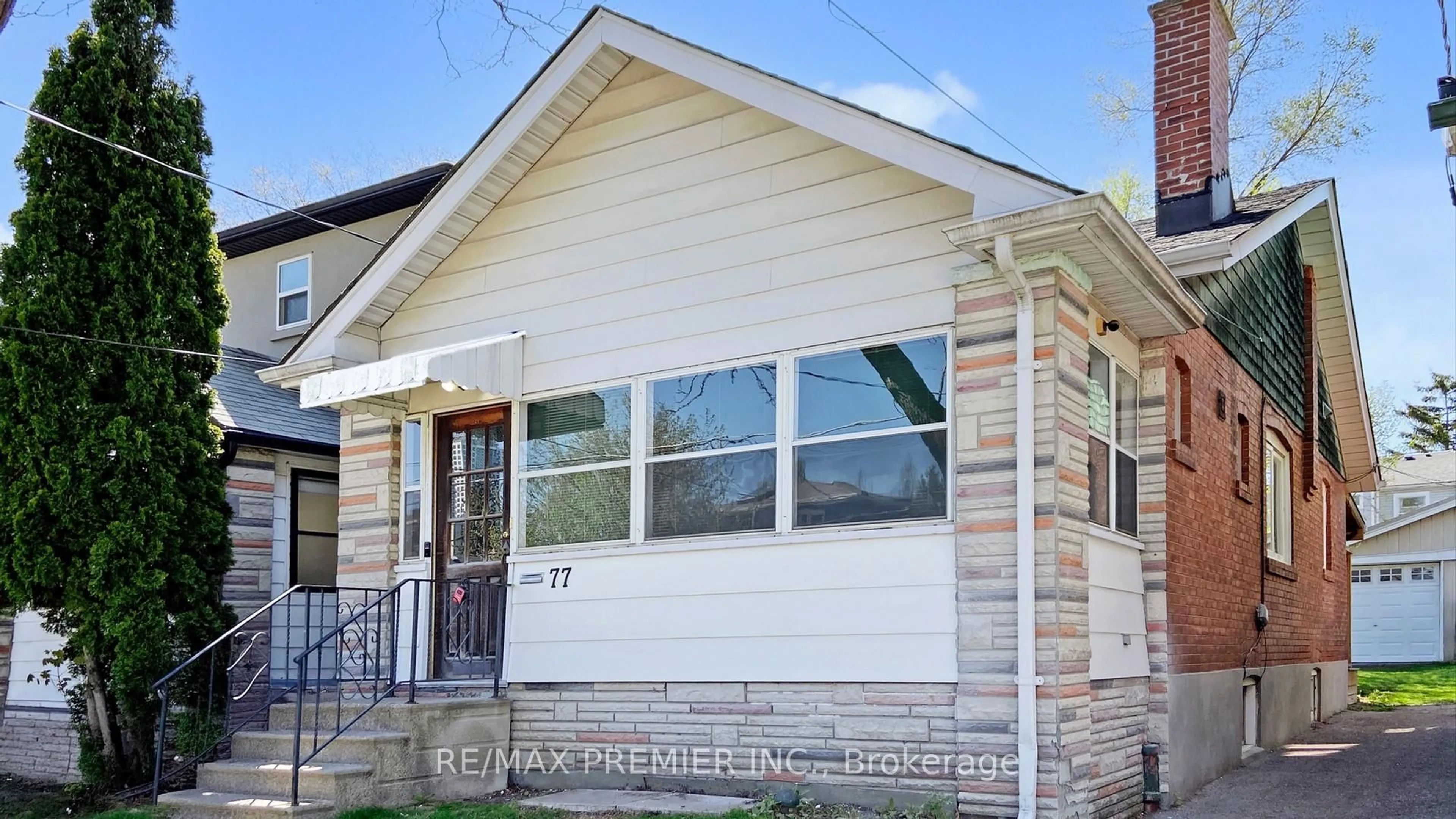 Home with vinyl exterior material, street for 77 Gatwick Ave, Toronto Ontario M4C 1W4