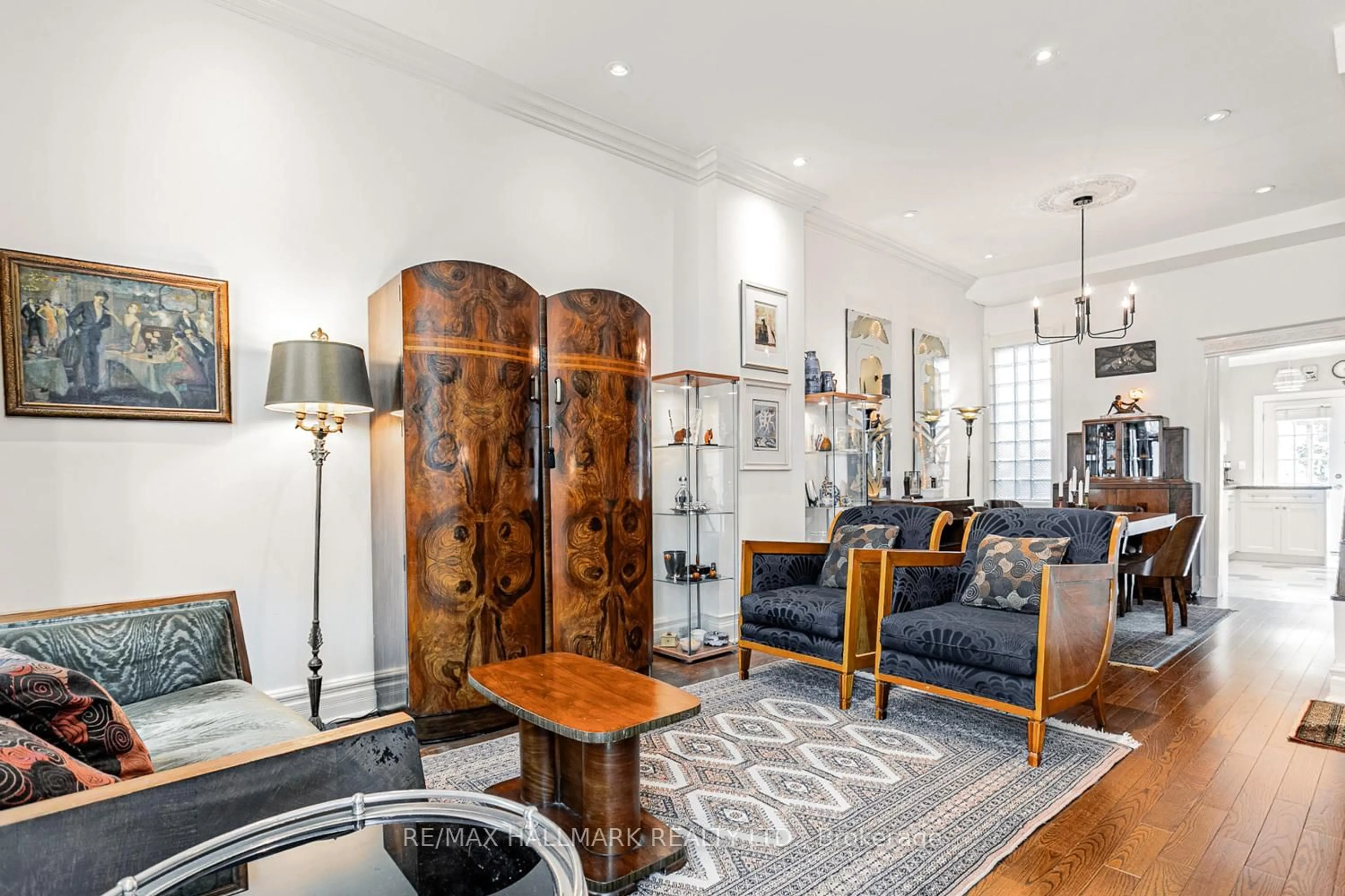 Living room with furniture, wood/laminate floor for 168 Boulton Ave, Toronto Ontario M4M 2J9