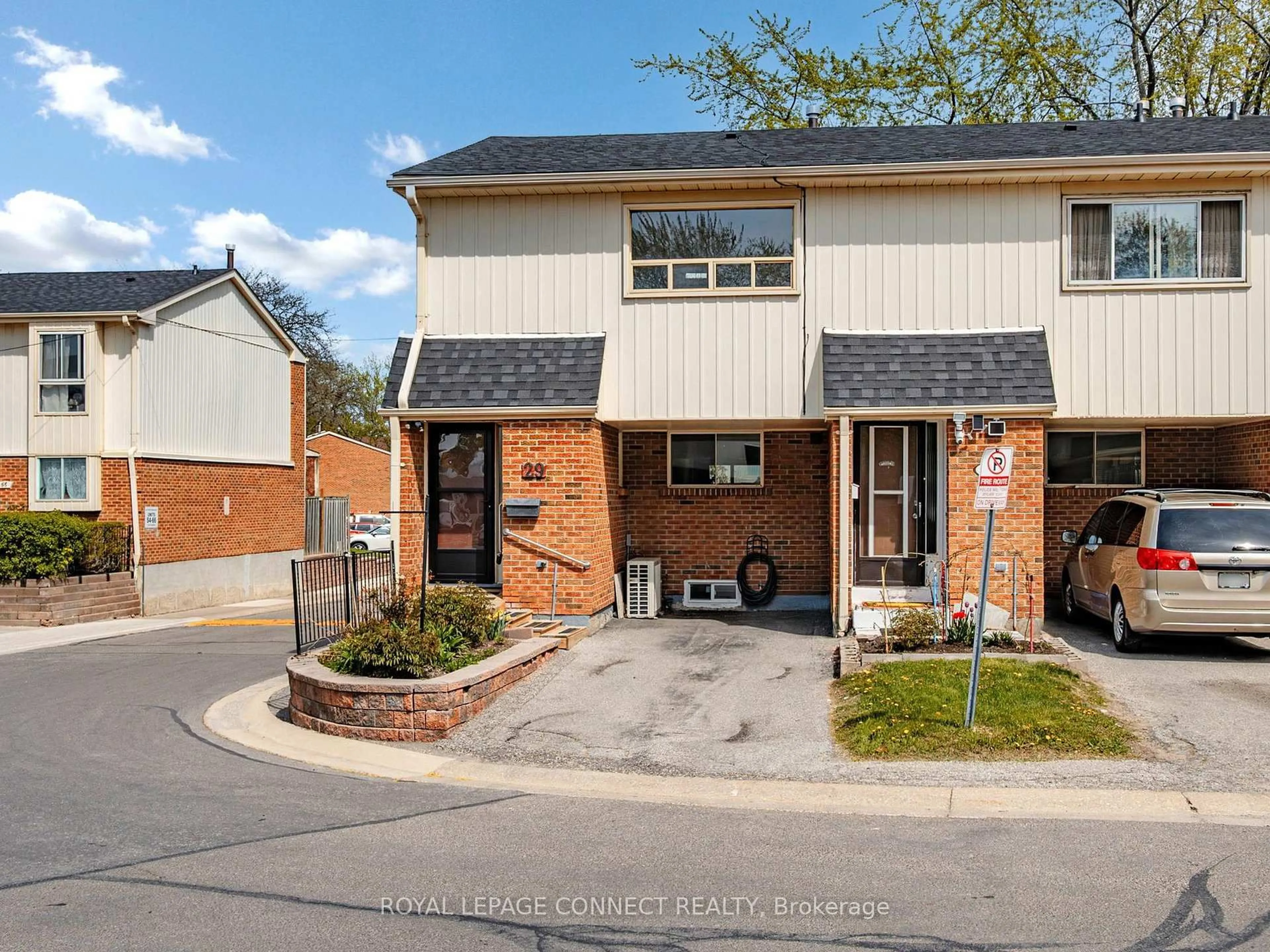 Home with brick exterior material, street for 2451 Bridletowne Circ #29, Toronto Ontario M1W 2Y4