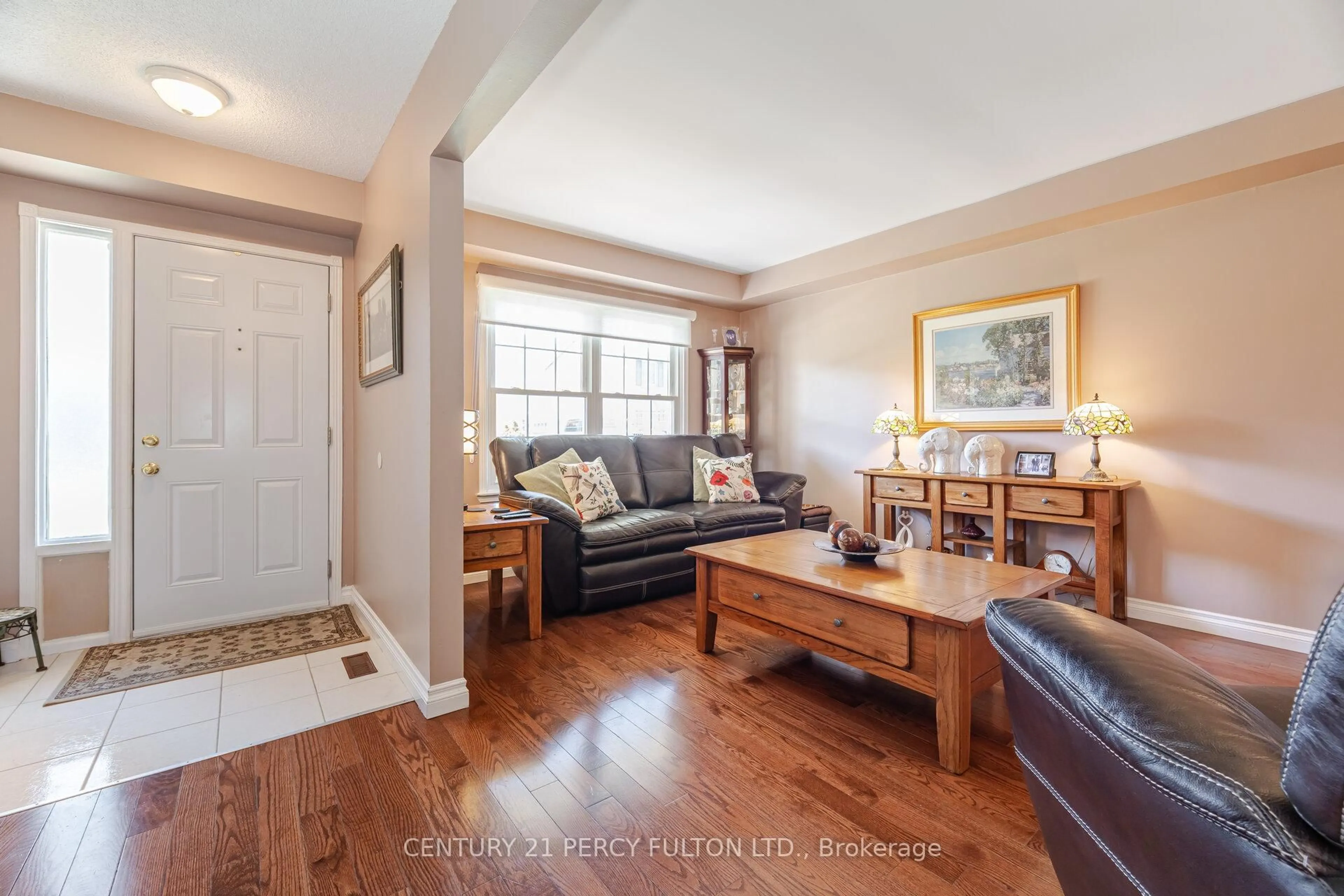 Living room with furniture, wood/laminate floor for 580 Eyer Dr #9, Pickering Ontario L1W 3B7