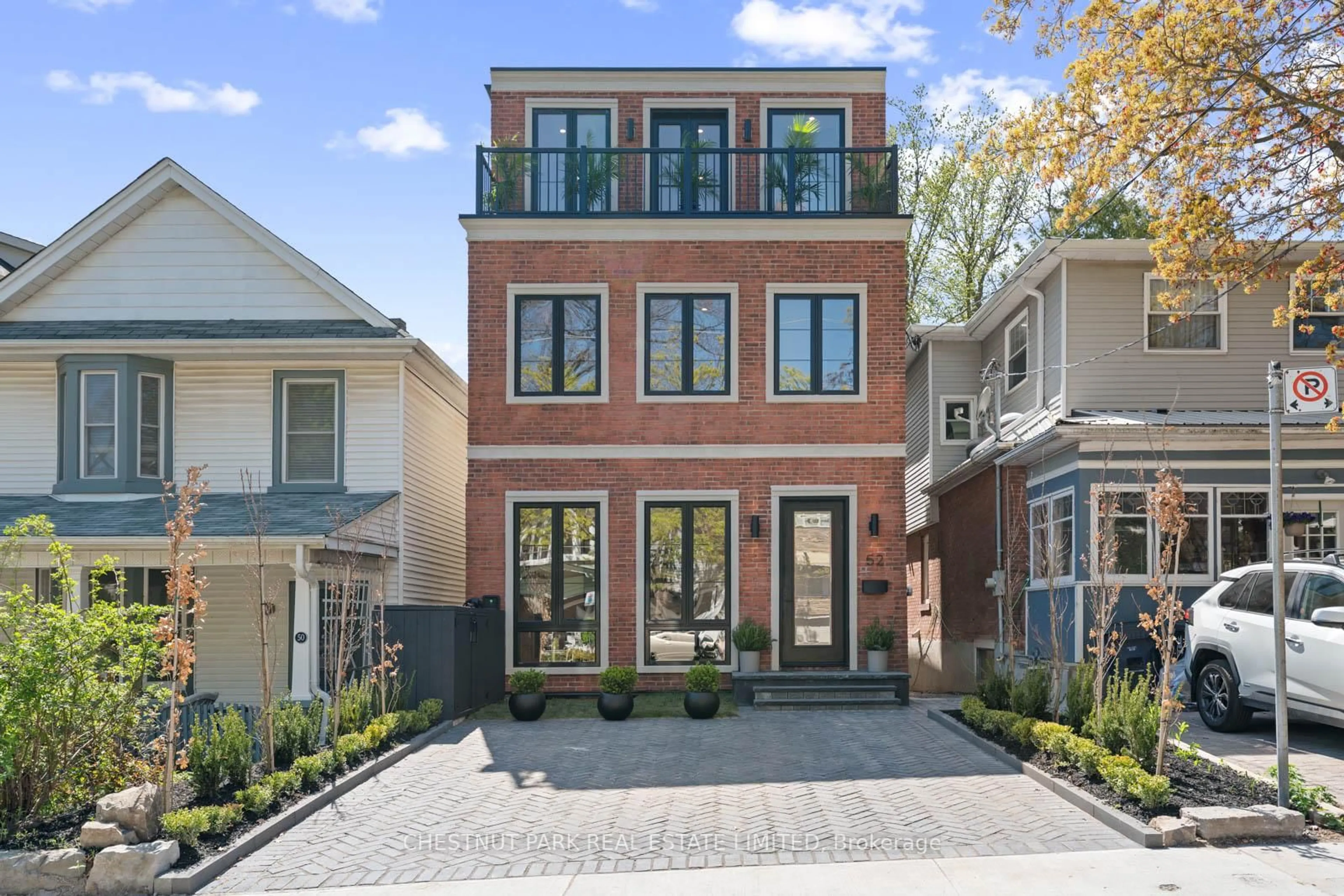 Home with brick exterior material, street for 52 Wheeler Ave, Toronto Ontario M4L 3V2