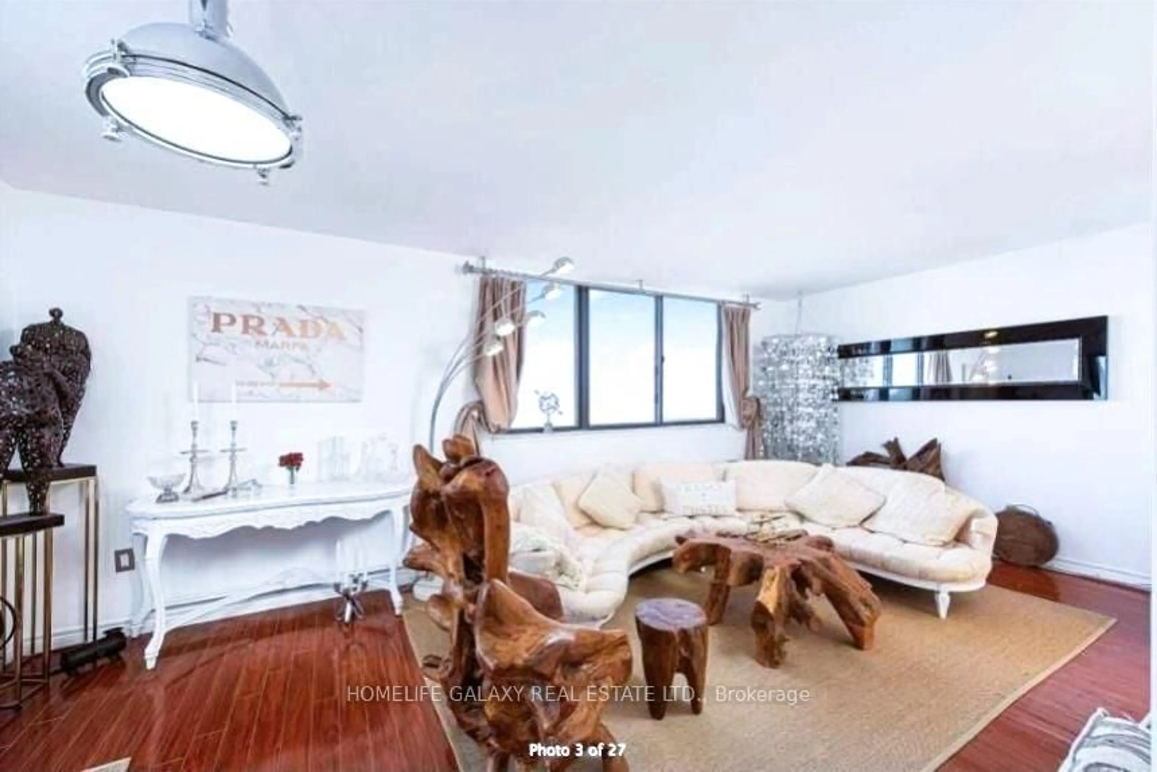 Living room with furniture, wood/laminate floor for 665 Kennedy Rd #704, Toronto Ontario M1K 5E2