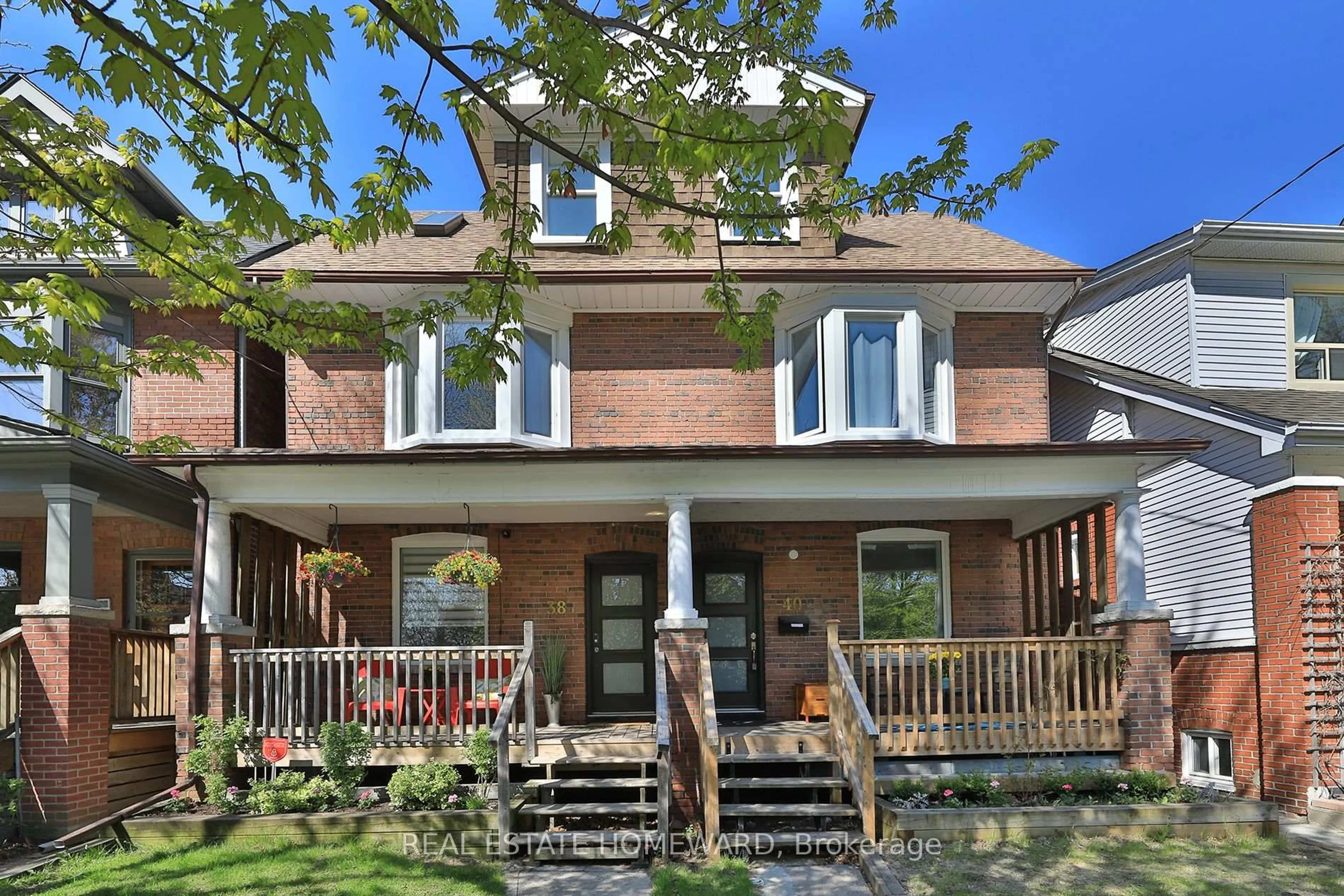 Home with brick exterior material, street for 38 & 40 Cedarvale Ave, Toronto Ontario M4C 4J4