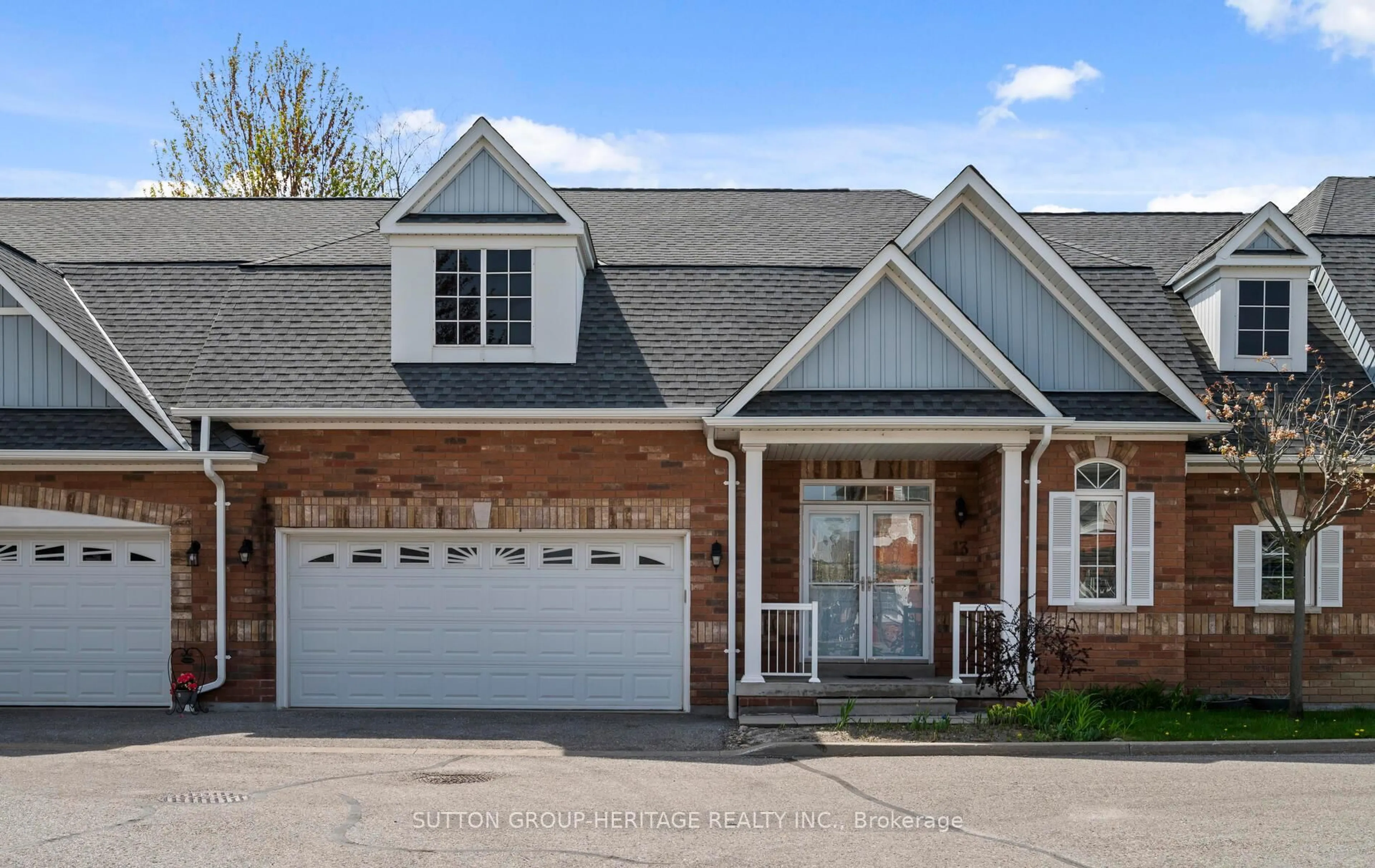 Home with brick exterior material, street for 13 Hirshfield Lane, Ajax Ontario L1T 4Z7