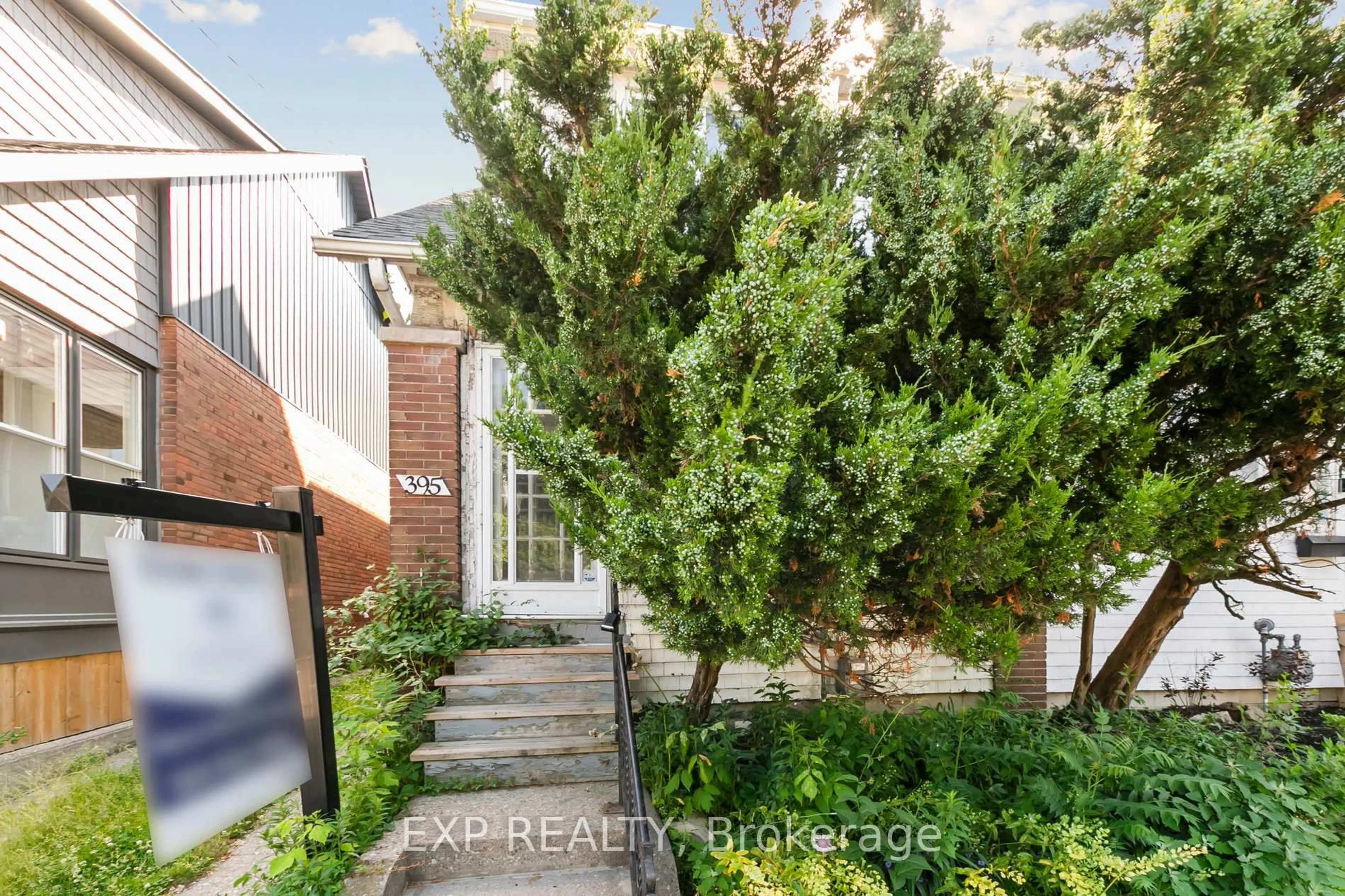 A pic from outside/outdoor area/front of a property/back of a property/a pic from drone, street for 395 Woodbine Ave, Toronto Ontario M4L 3P7