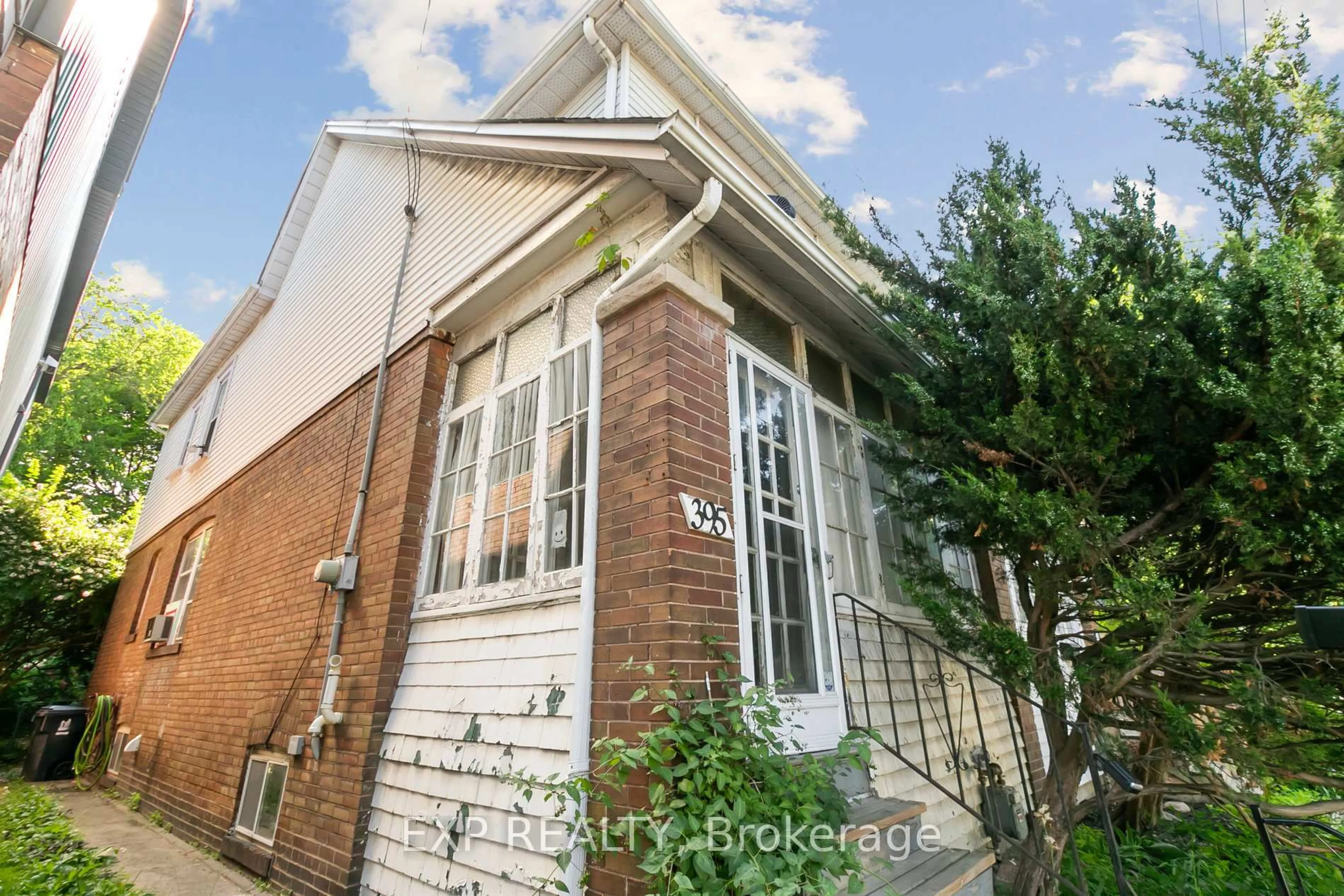 Home with brick exterior material, street for 395 Woodbine Ave, Toronto Ontario M4L 3P7