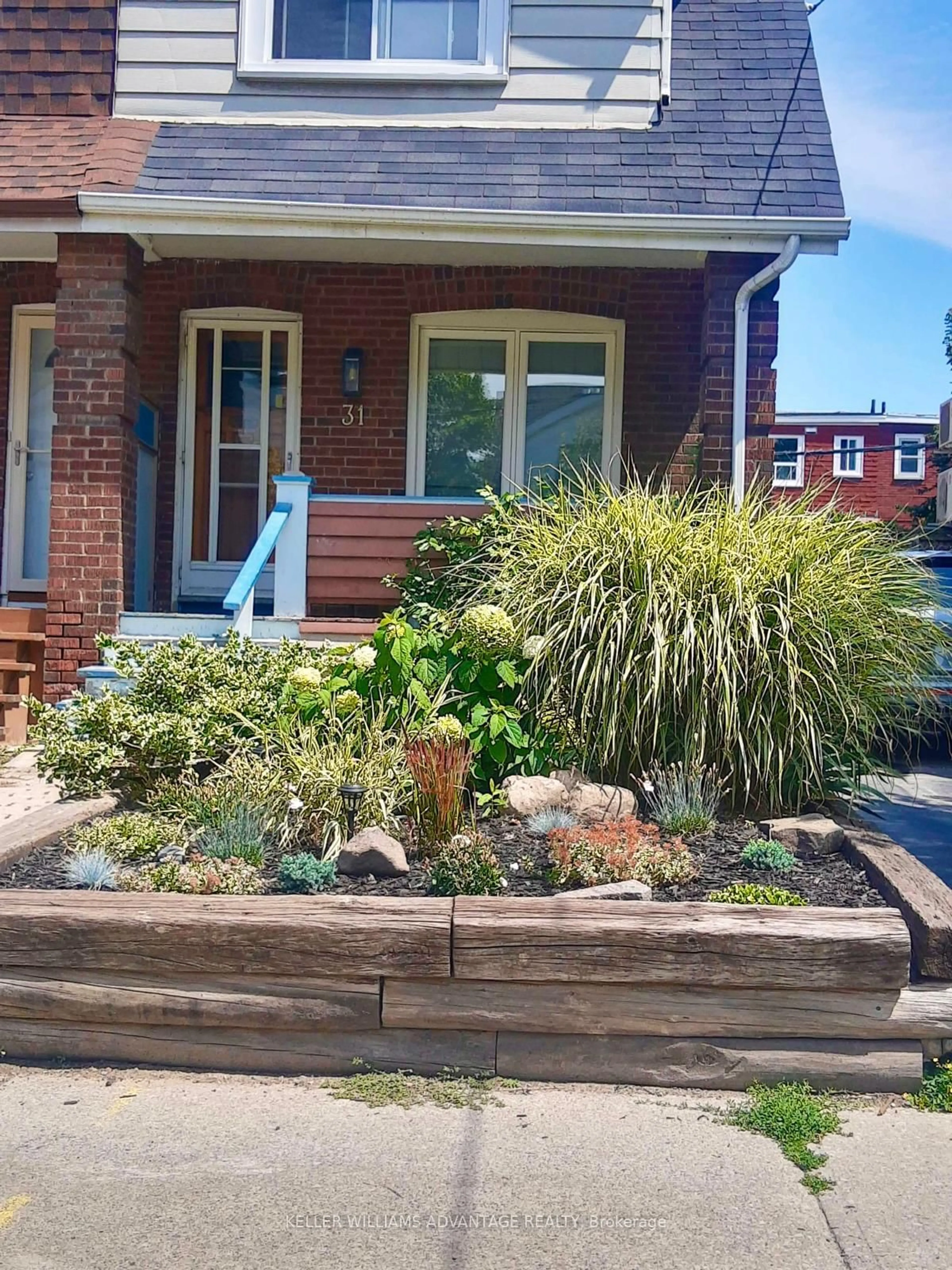 Home with brick exterior material, street for 31 Hiltz Ave, Toronto Ontario M4L 2N6