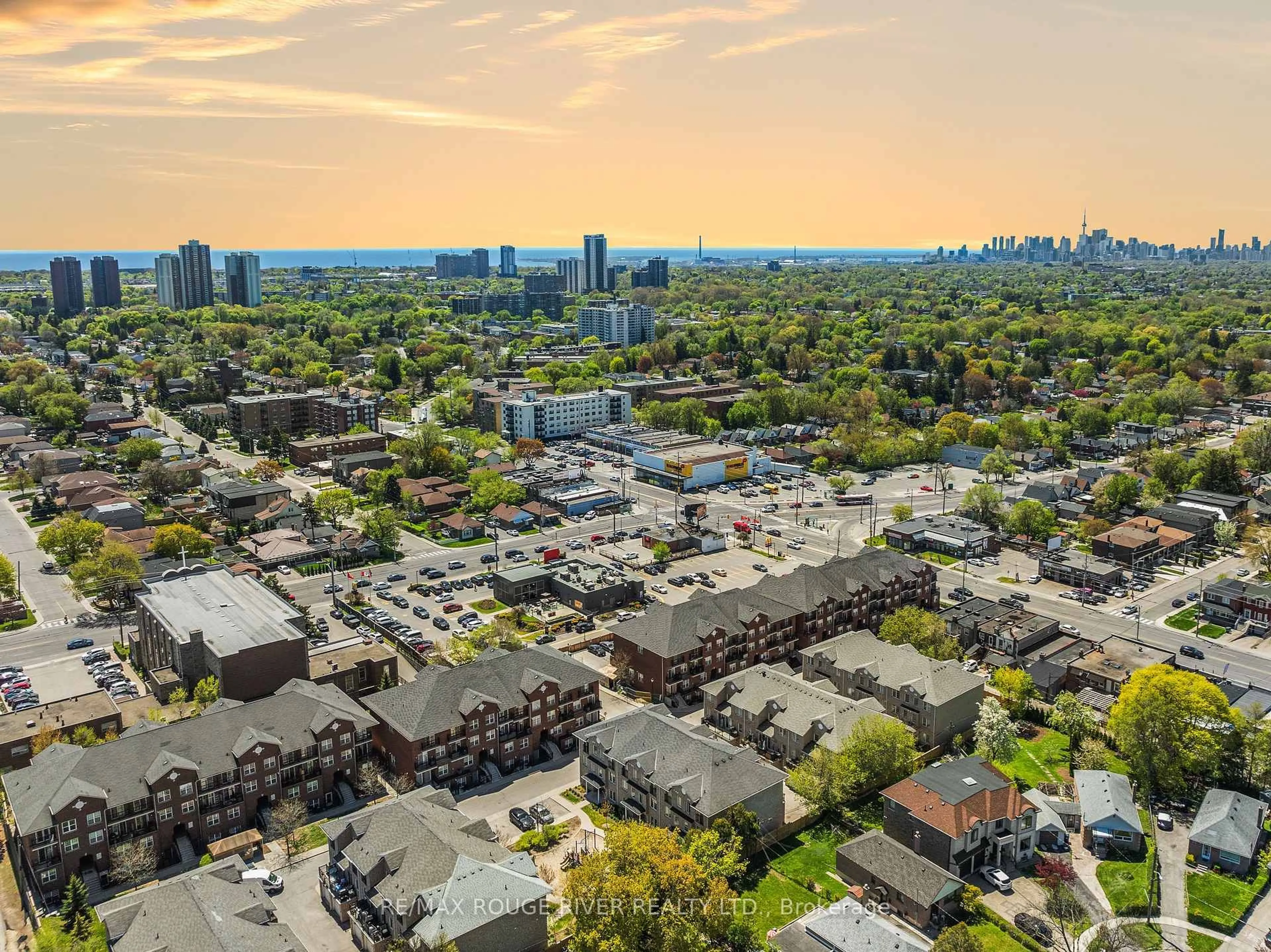 A pic from outside/outdoor area/front of a property/back of a property/a pic from drone, city buildings view from balcony for 25 Strangford Lane #103, Toronto Ontario M1L 0E5