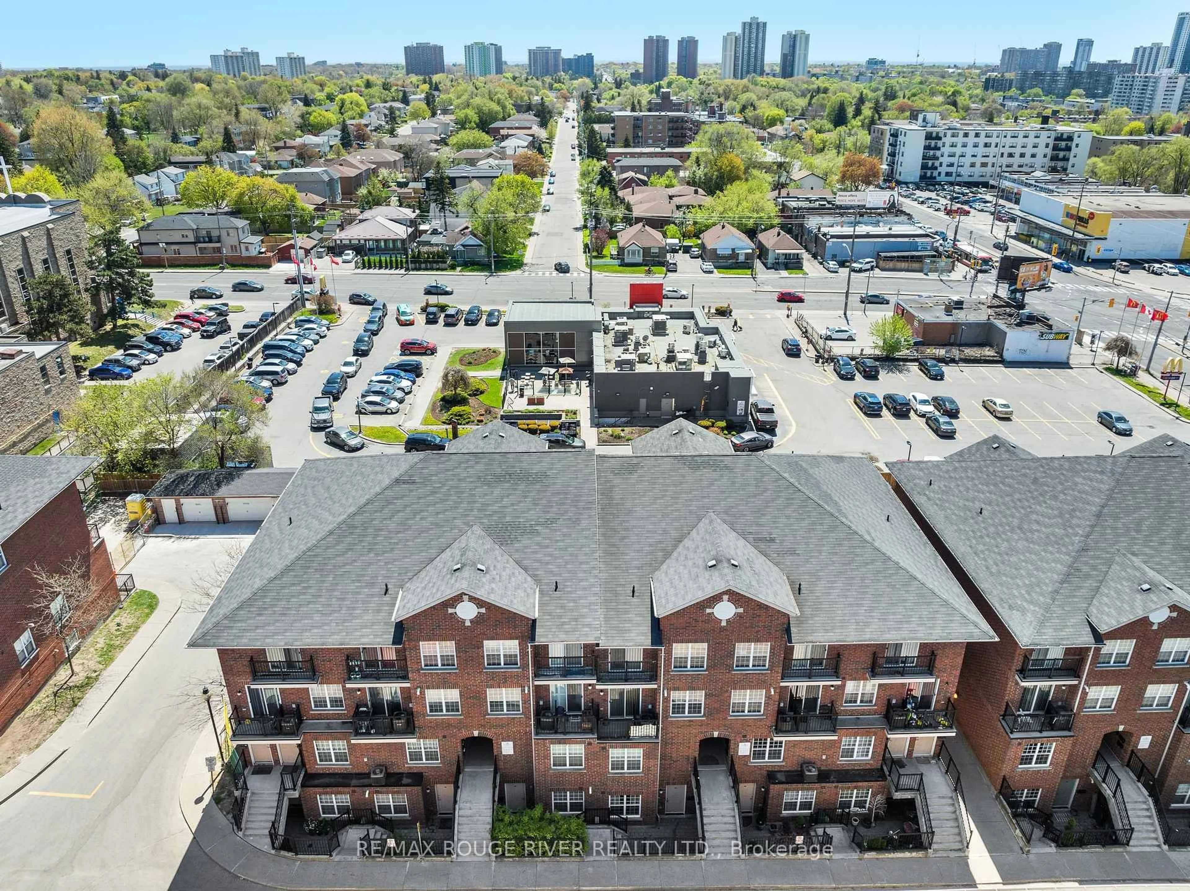 A pic from outside/outdoor area/front of a property/back of a property/a pic from drone, city buildings view from balcony for 25 Strangford Lane #103, Toronto Ontario M1L 0E5