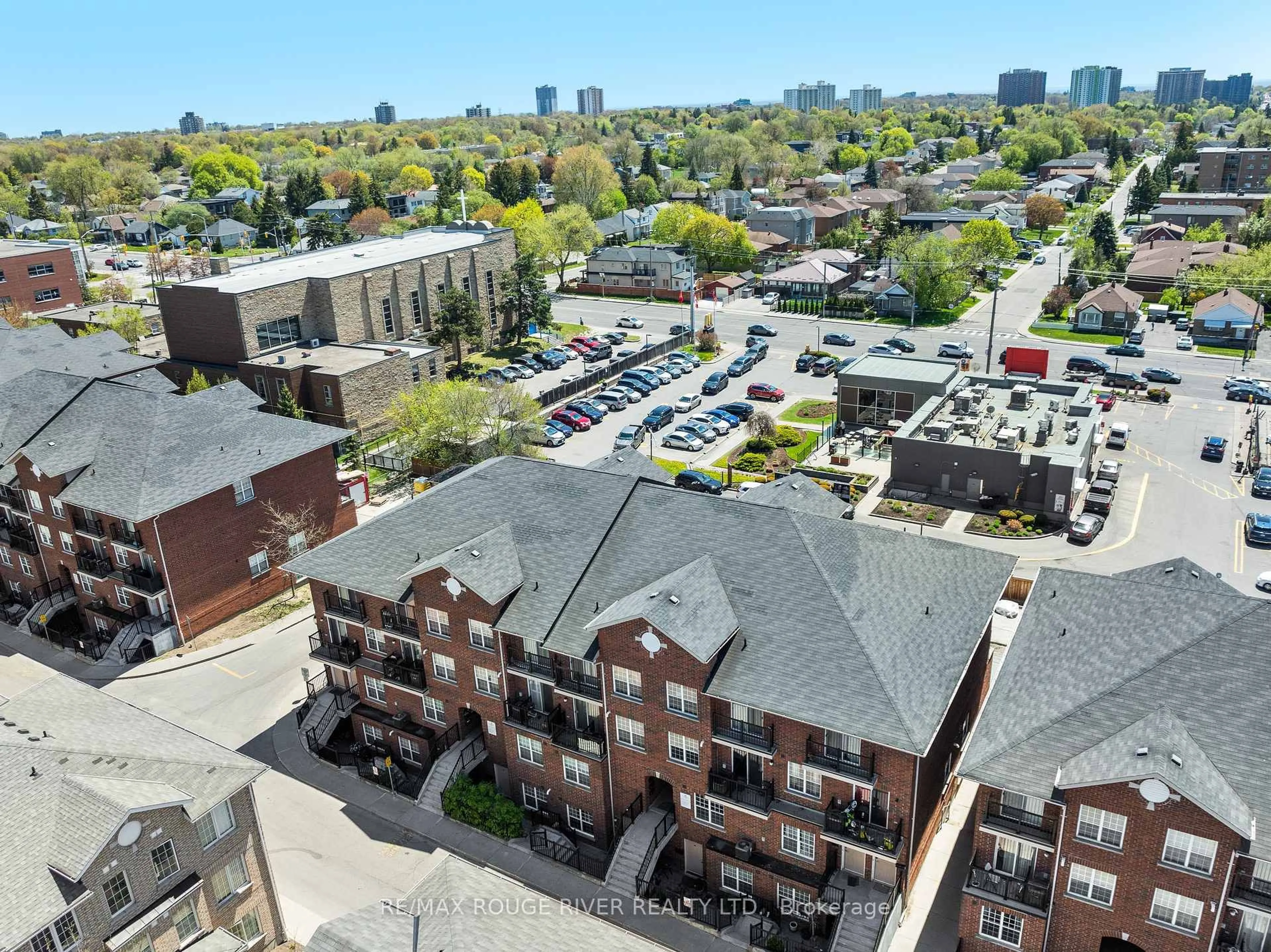 A pic from outside/outdoor area/front of a property/back of a property/a pic from drone, city buildings view from balcony for 25 Strangford Lane #103, Toronto Ontario M1L 0E5