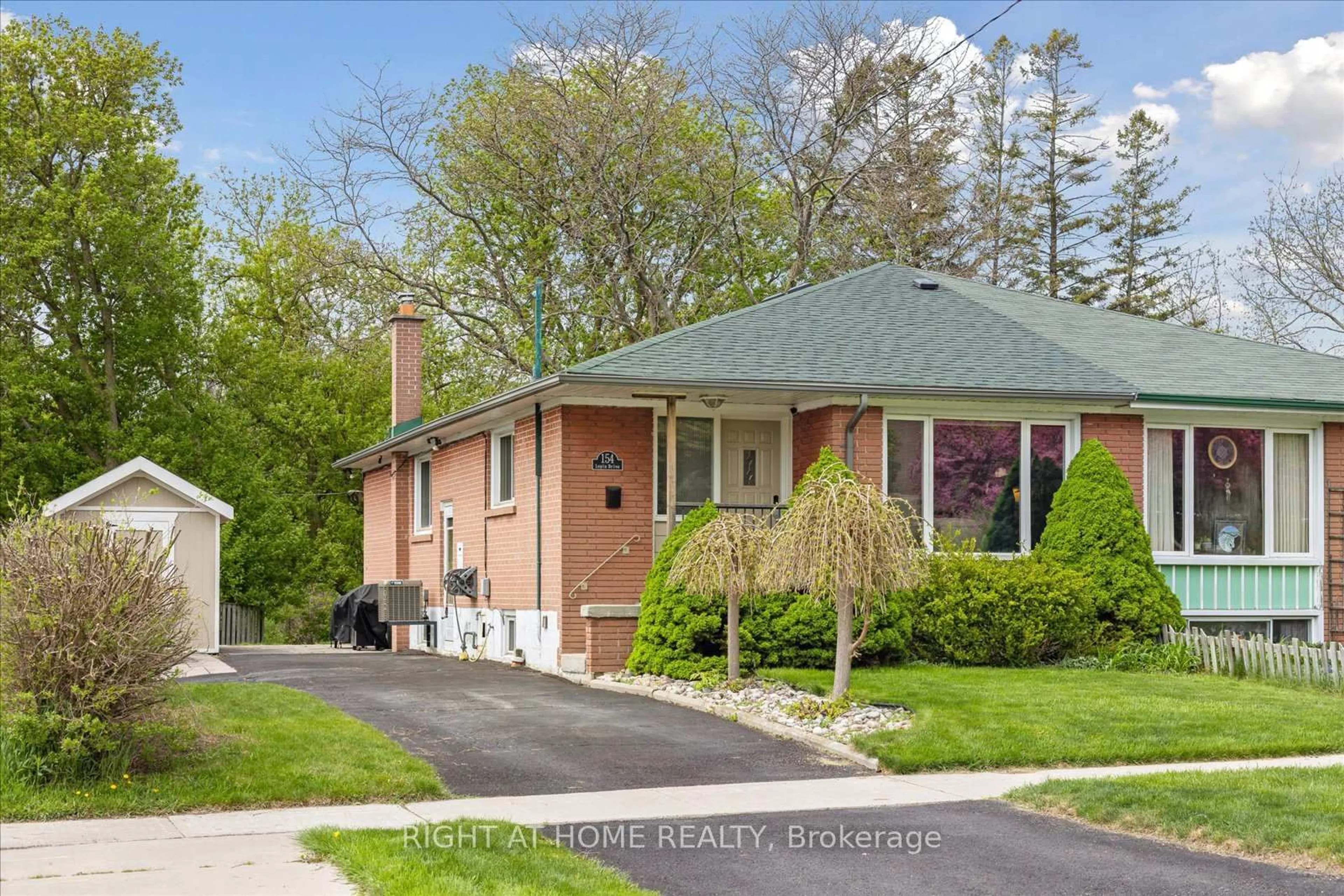 Home with brick exterior material, street for 154 Lupin Dr, Whitby Ontario L1N 1X8