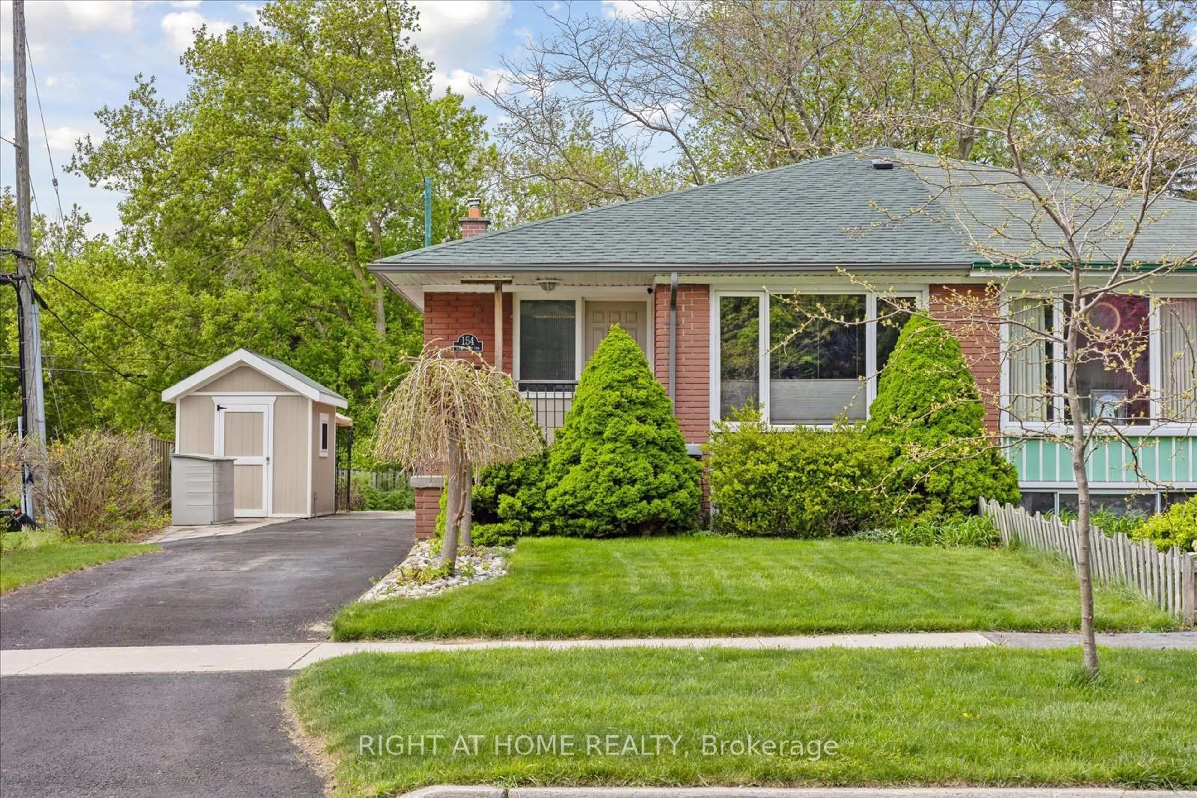 Home with brick exterior material, street for 154 Lupin Dr, Whitby Ontario L1N 1X8