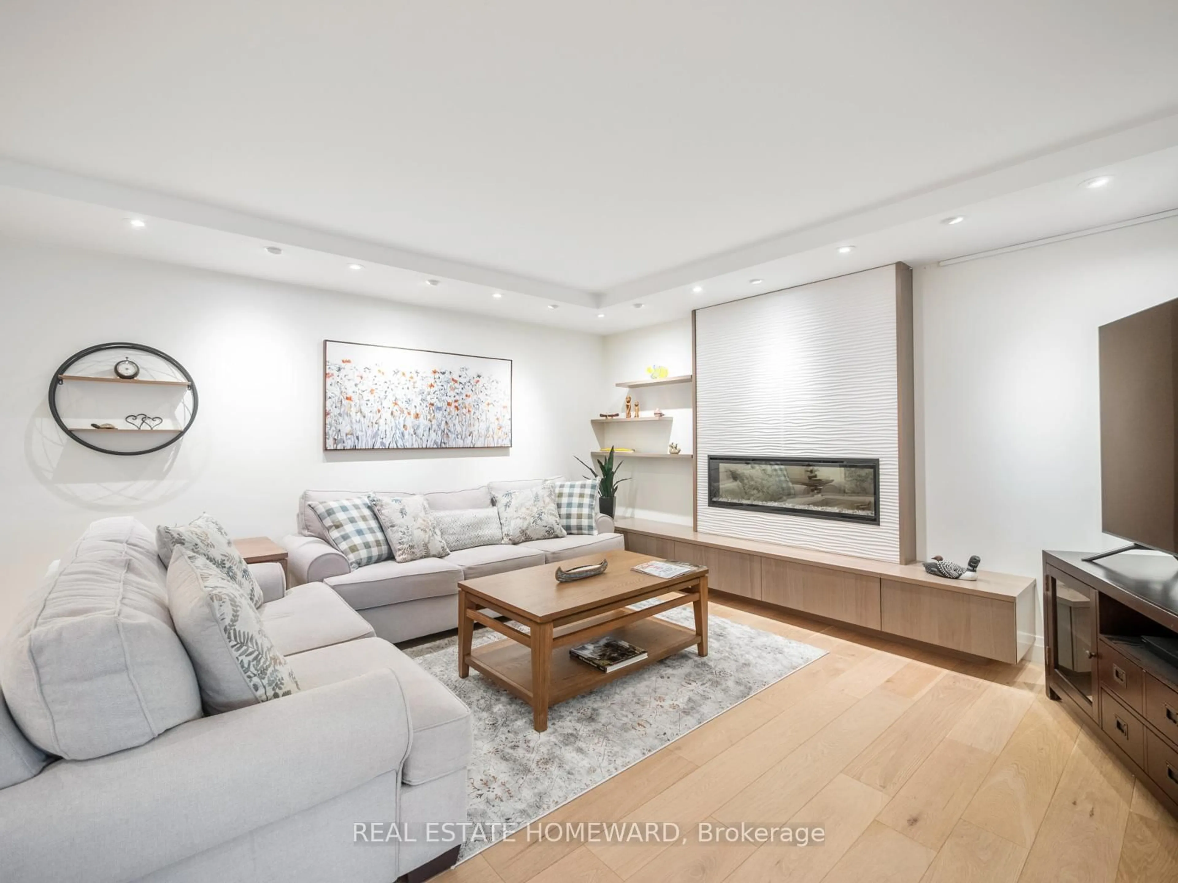 Living room with furniture, wood/laminate floor for 20 Guildwood Pkwy #311, Toronto Ontario M1E 5B6