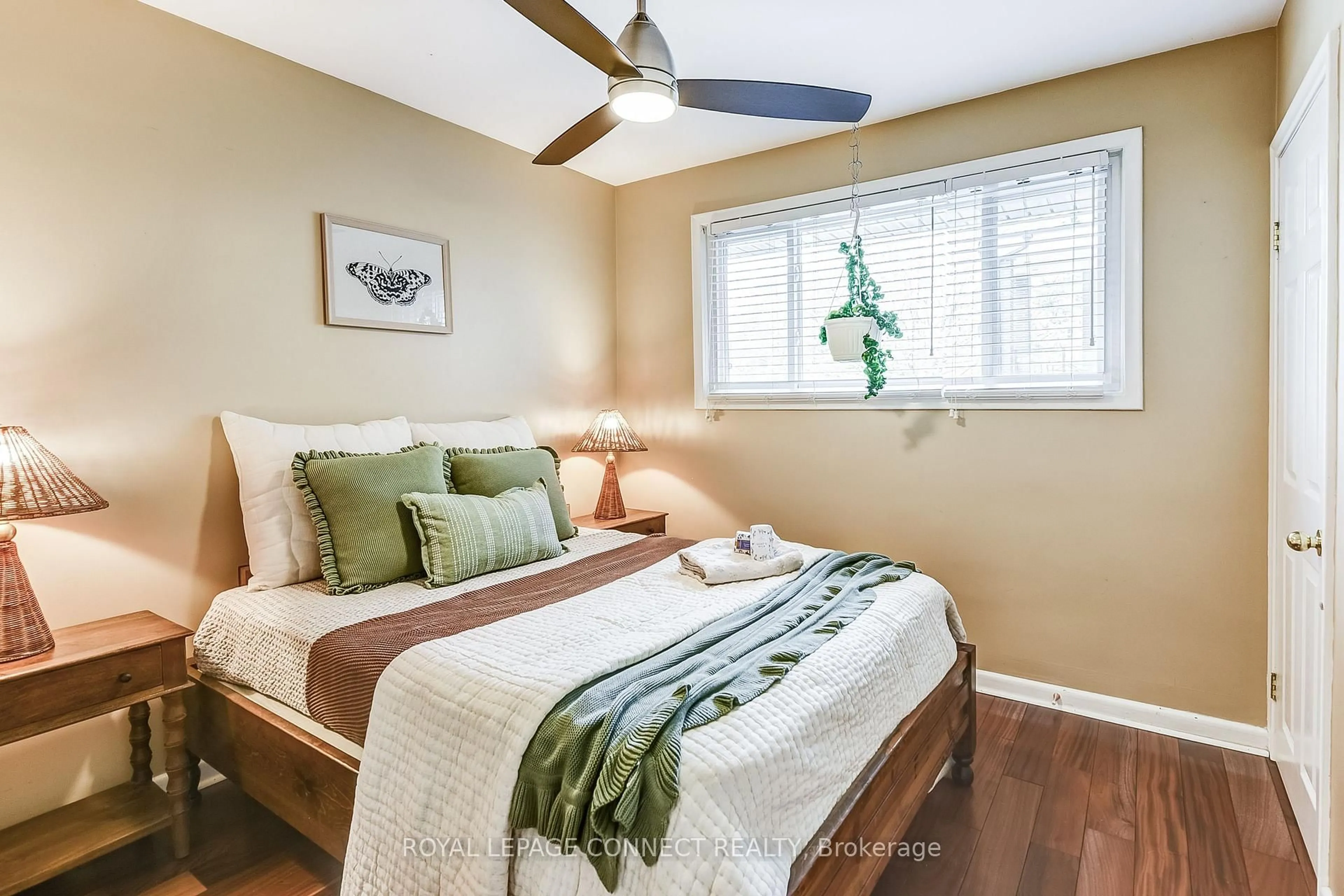 Bedroom with bed, wood/laminate floor for 257 East Ave, Toronto Ontario M1C 2W2