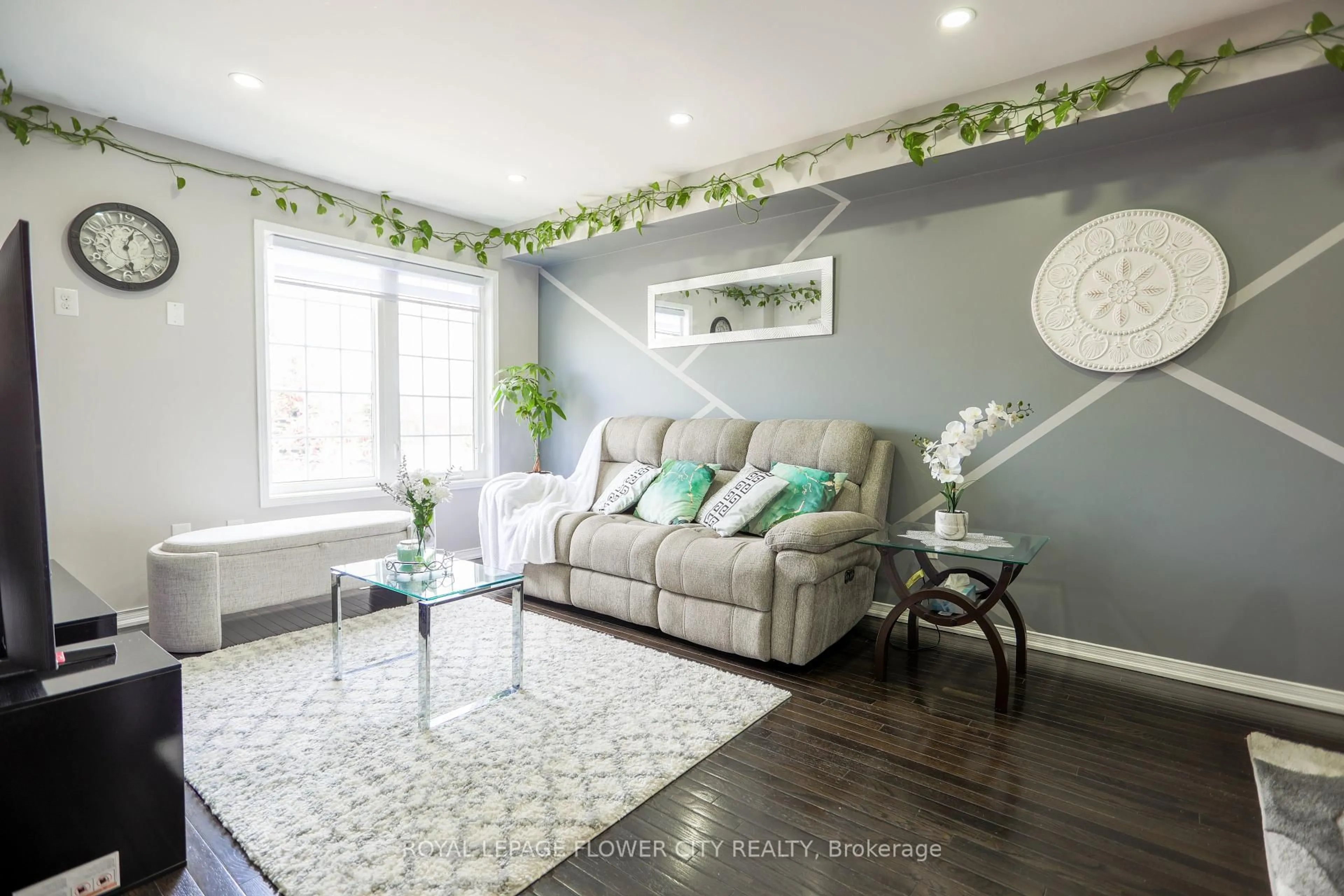 Living room with furniture, wood/laminate floor for 42 Lander Cres, Clarington Ontario L1C 0L4